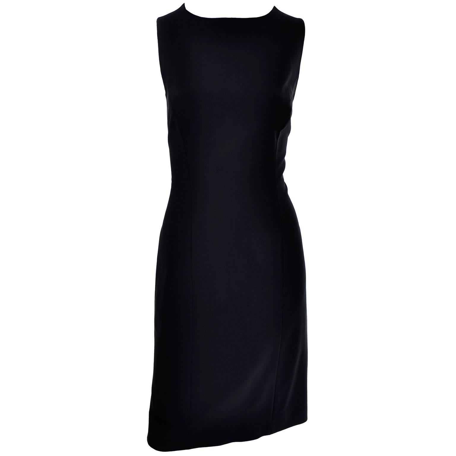 This Giorgio Armani Le Colleczioni little black dress is a  classic staple must for any wardrobe!  This vintage sleeveless dress is made of 96% wool, closes with a back zipper, and is fully lined. The dress is labeled 8 (please refer to measurements