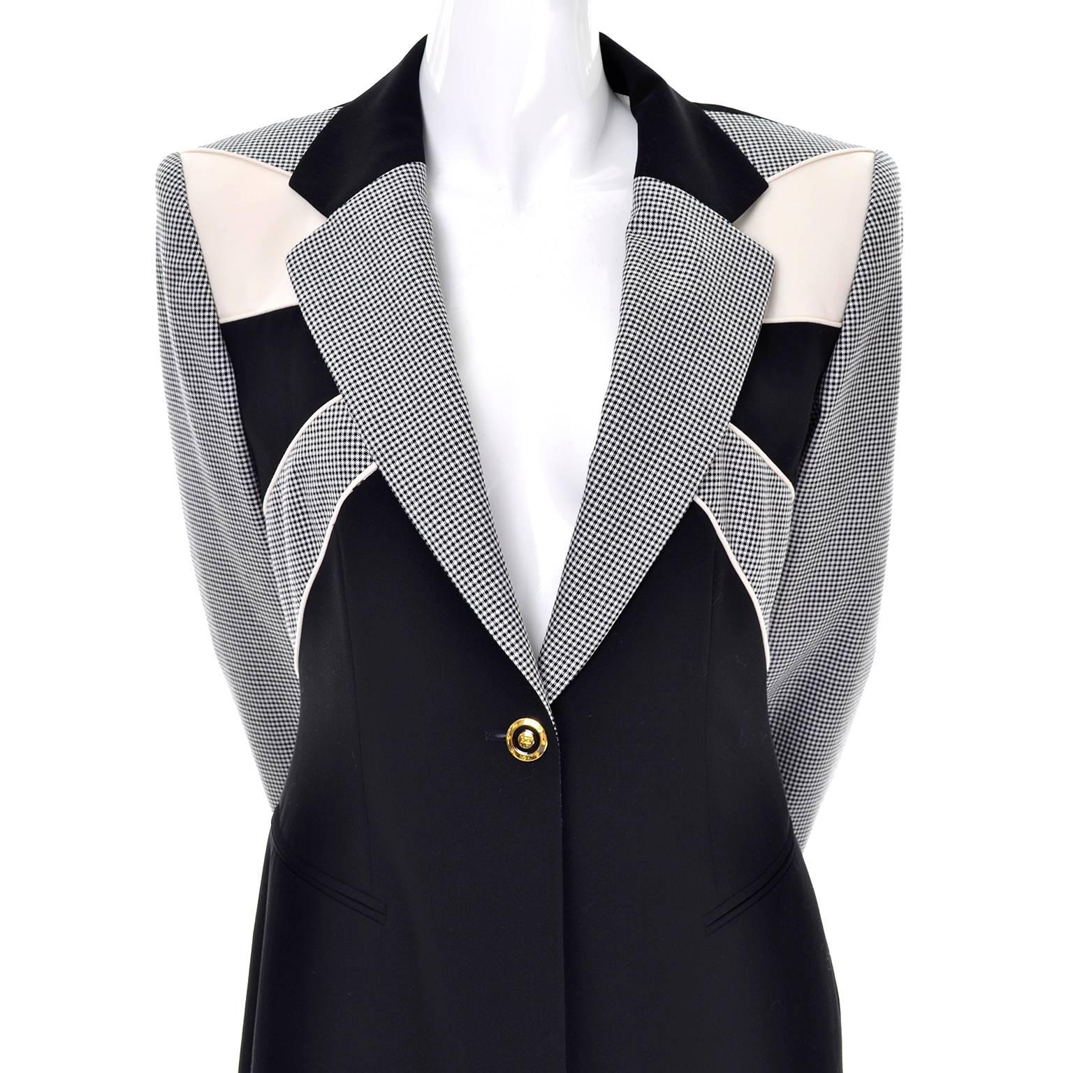 This is an exceptional black and white checked blazer from Escada designed by Margaretha Ley. This vintage long blazer features a radial design of alternating solid black, solid cream, and black and white checked, with checked sleeves and black from