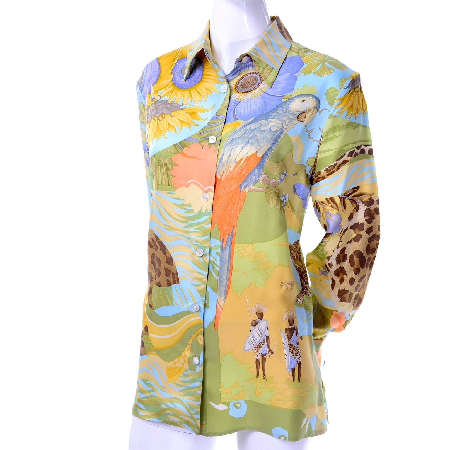 This is a beautiful vintage Ferragamo silk blouse in a tropical island novelty print that includes island natives, parrots, leopards, and gorgeous plants and flowers.  The blouse has long sleeves, buttons up the front and is labeled a US size 8. 