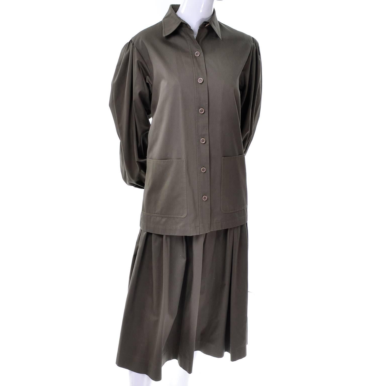 This Yves Saint Laurent vintage 2 piece outfit includes a skirt and a shirt that is cut like a jacket with front pockets.  This khaki olive green 2 piece heavy cotton suit is in excellent condition and the top has the I Magnin label as well.  The