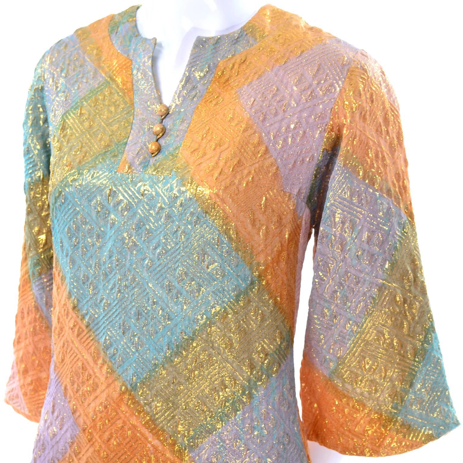 We love this pretty Dynasty long dress in metallic shades of blue, orange, purple, pink and gold!  The caftan style dress is fully lined and has 14