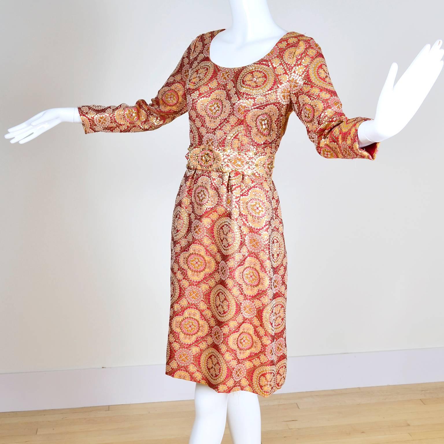 This vintage dress was designed by Adele Simpson in the 1960's. This dress would make a perfect cocktail dress and is made in a metallic brocade fabric with deep orange, copper, gold and yellow tones and comes with its original fabric belt, which is