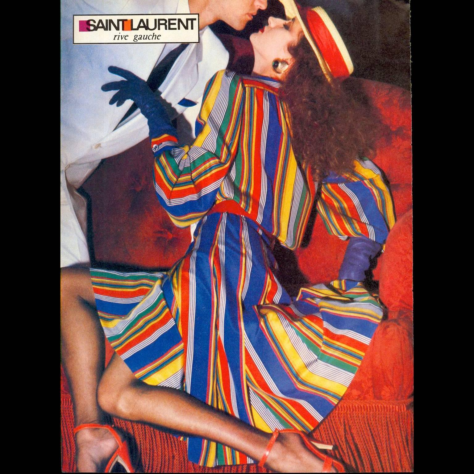 This beautiful silk, multi colored striped vintage dress was designed by Yves Saint Laurent in the 1980s. This great YSL dress has buttons up the front of the bodice, a side zipper, and attached sash at neck.  The dress is labeled a size 36 and has