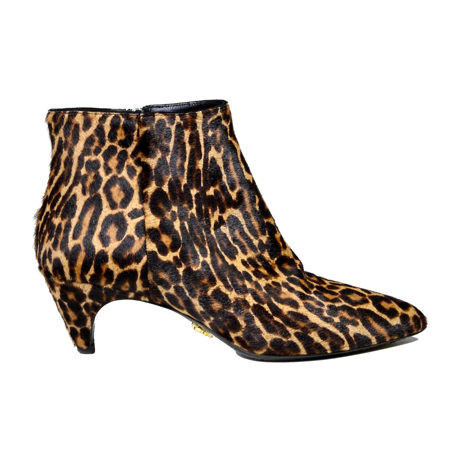 These are fabulous Prada leopard-print dyed calf hair booties with pointed toes and the perfect low kitten heels. These boots are lined in leather and have leather insoles and outsoles. They have an interior side zipper, and the gold Prada Milan