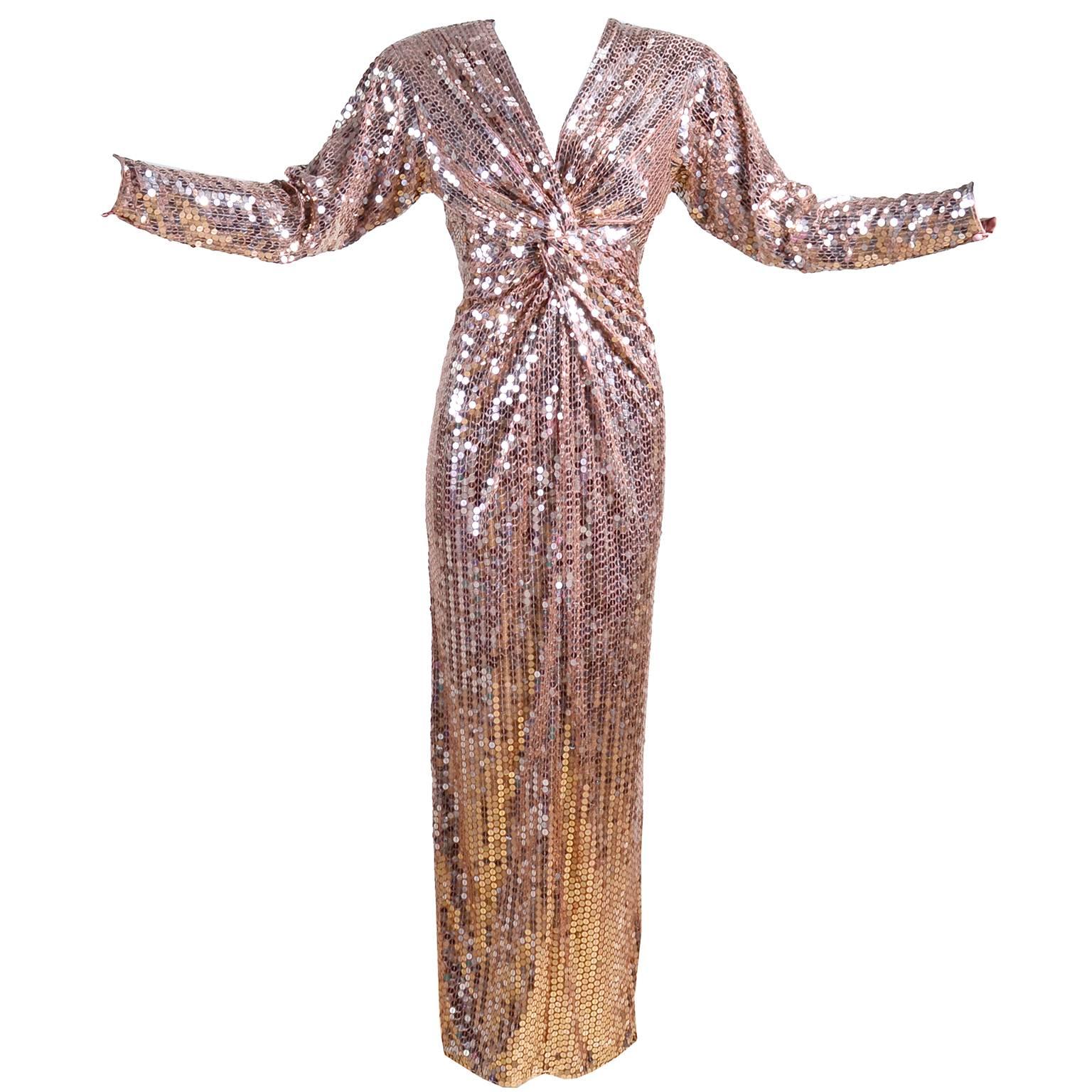 This is an incredible early 1980's  slinky vintage Oleg Cassini evening gown covered in rose gold sequins! This sparkling long dress twists in the front at the bottom of the V neckline. It has slight shoulder pads, as well as a slit up the back. We
