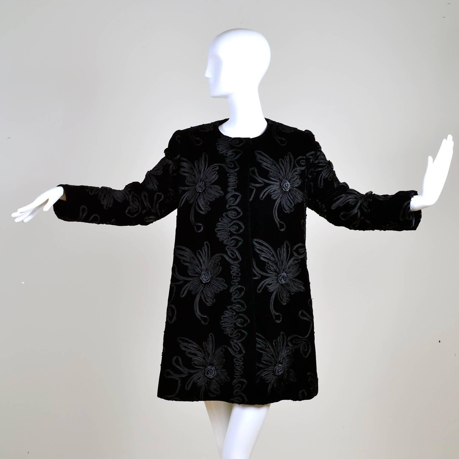 This Estevez couture black vintage evening coat is a really spectacular piece!  The coat is made of black velvet and it has incredible black soutache trim that forms flowers throughout!  The jacket has shoulder pads, a single snap closure at the