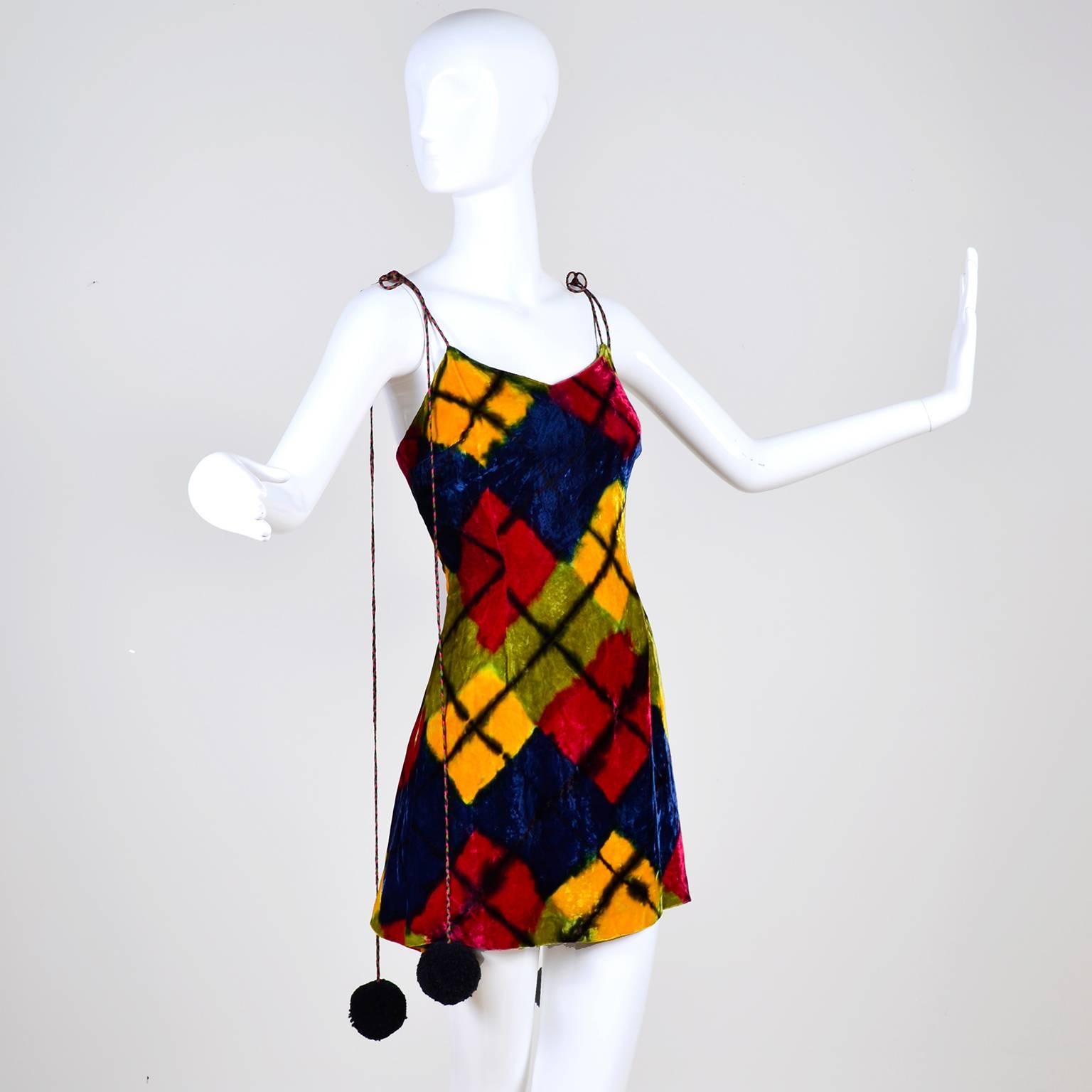 This fabulous vintage dress was designed by Todd Oldham for his 1994/95 Fall/Winter collection. The incredible dress is a harlequin or argyle printed rayon velvet with a back zipper. The dress is lined in a gorgeous tye dyed silk. The long ties can