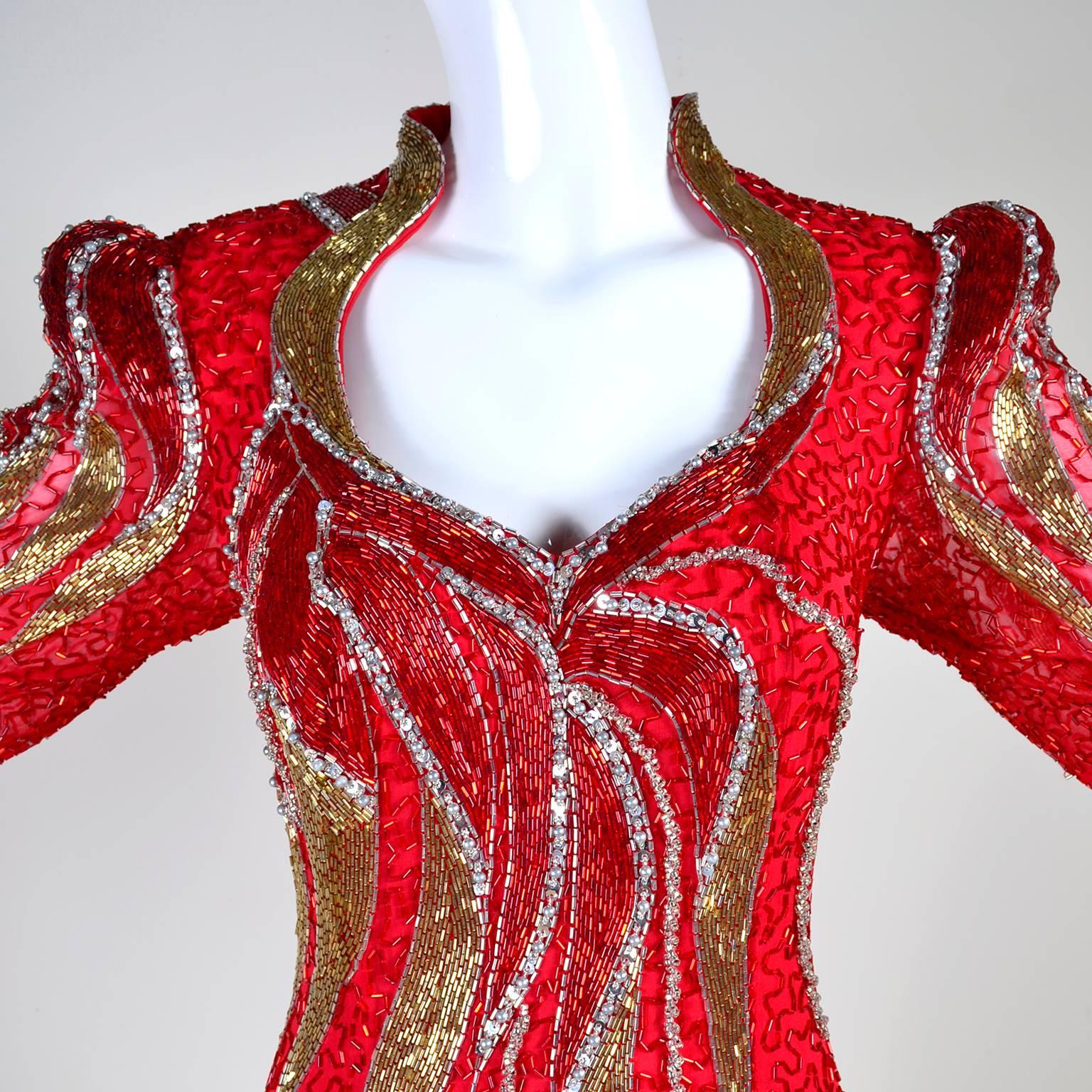 This sensational vintage dress was designed by Oleg Cassini and it has the Black Tie label.  This truly stunning dress is beautifully beaded and was purchased at Neiman Marcus in the 1980's.  The dress has red, gold and silver beads, long sleeves,