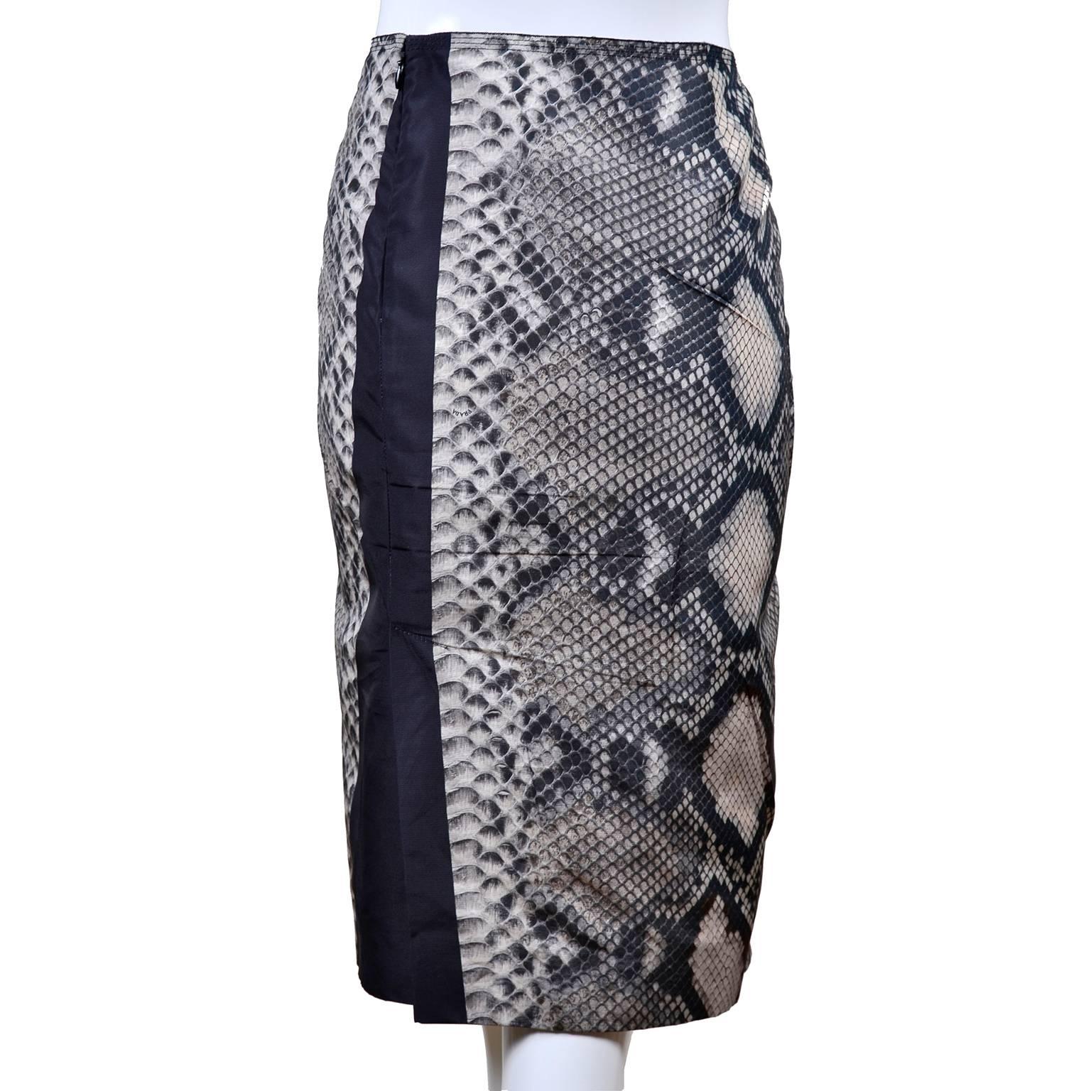 This fabulous silk skirt from Prada is in a snakeskin print silk and is from the Spring/Summer 2009 collection.  The skirt has black and white vertical bands on the front and back and a 9 and 1/2