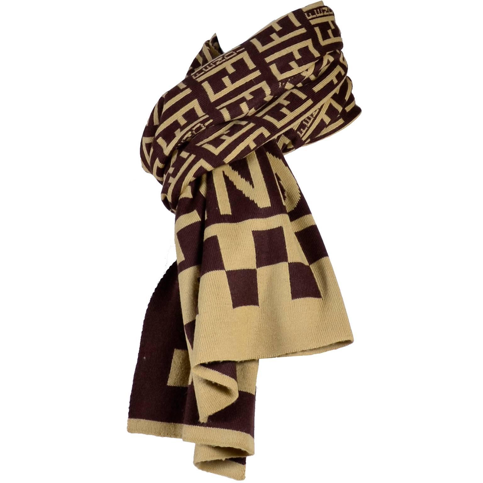 This is a great long vintage scarf from Fendi in brown and creamy beige with the Fendi logo and the word Fendi in the fabric.  The scarf measures 13 x 68” and is 70% cashmere and 30% wool. Made in Italy. 