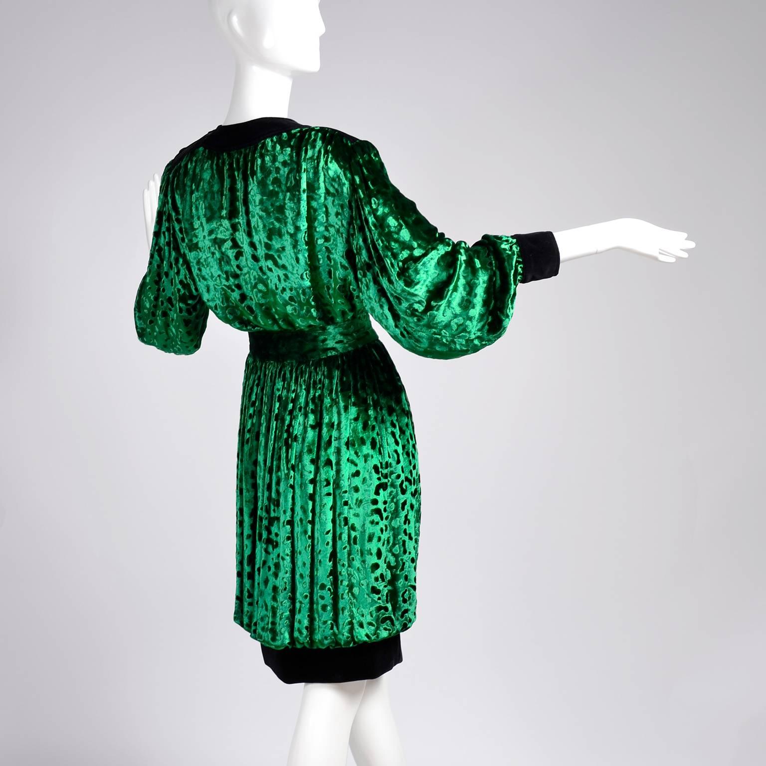 This is an absolutely stunning green silk velvet leopard pattern 2 piece ensemble from Yves Saint Laurent.  This beautiful outfit includes a lined bubble skirt with black velvet hemline and a top with velvet trim at the shoulders and neckline and
