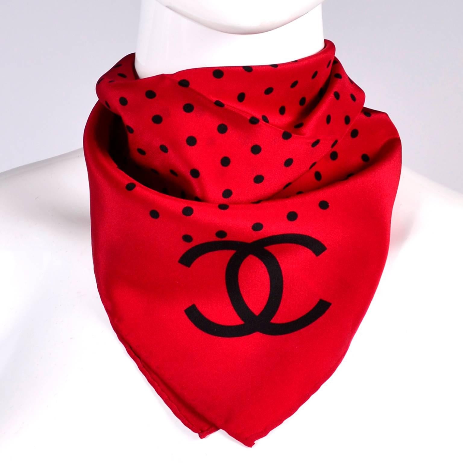 This is a beautiful red silk Chanel scarf with black polka dots and the CC logo. This scarf would make a great gift and is a perfect neck scarf to wear under a jacket or blouse.  