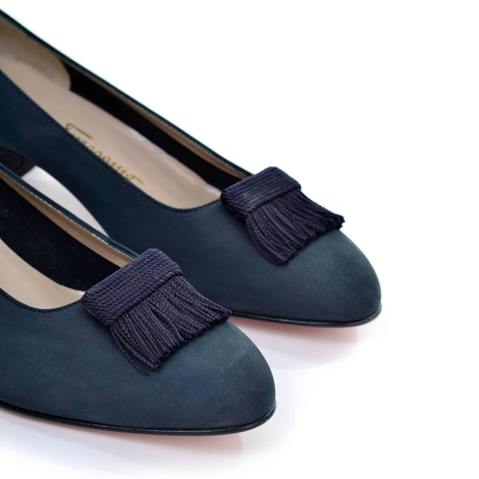 These Vintage Ferragamo shoes have never been worn!  Salvatore Ferragamo Boutique navy blue suede slip on shoes with a large woven silk or rayon fringed tassels on uppers wth rounded toes. These loafer-like shoes have a short block heel and were