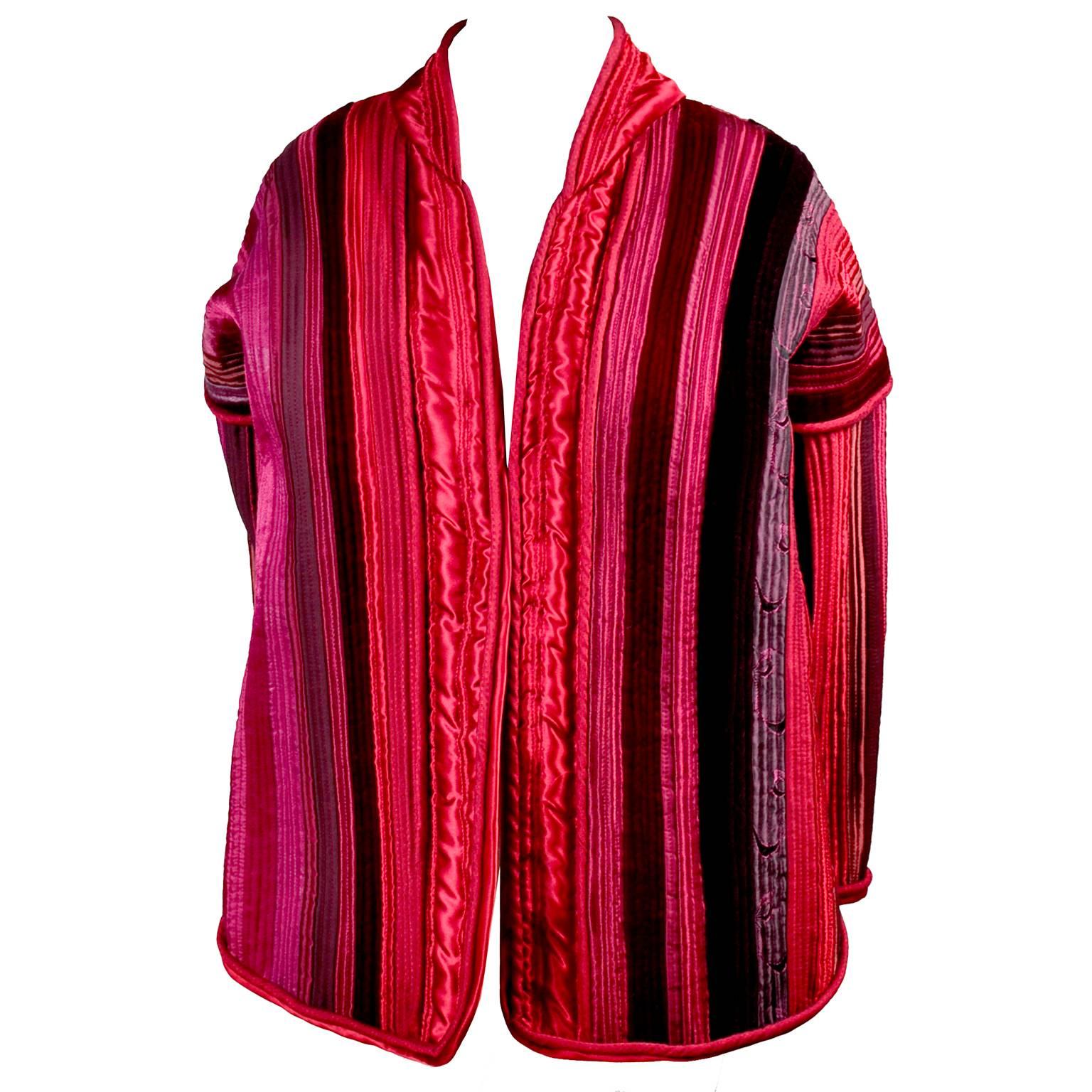 Rich reds, pink and purple make this silk satin and velvet jacket a stunning piece!  This one of a kind jacket was purchased at a high end clothing boutique called Elizabeth Street in Portland Oregon in the late 1980's.  The owner carried many one
