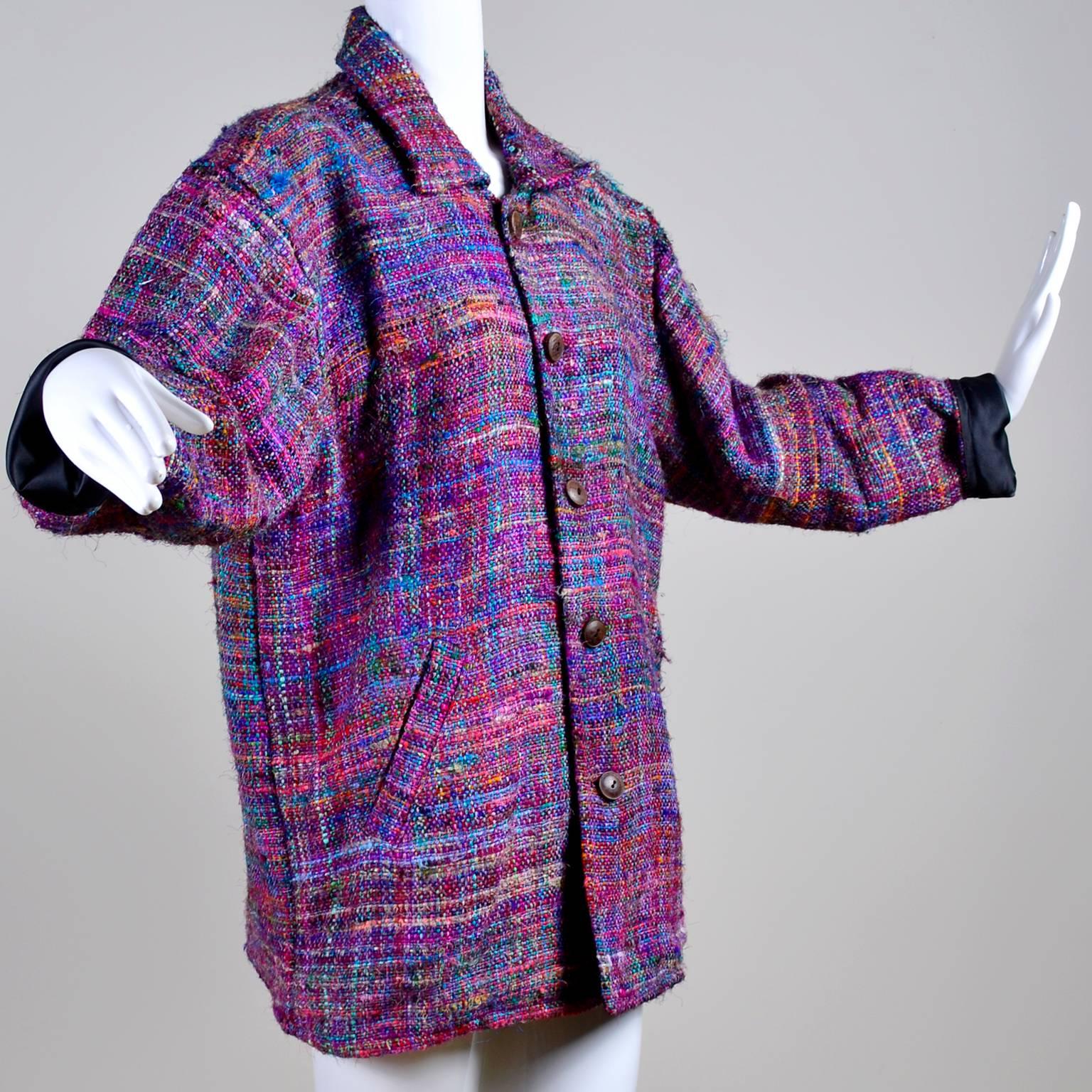 This is a colorful vintage 100% silk tweed jacket that was made in Nepal in the 1980's. The jacket has front slash pockets and closes in the front with wood buttons.  We acquired this jacket from an estate we purchased that had very unique boutique