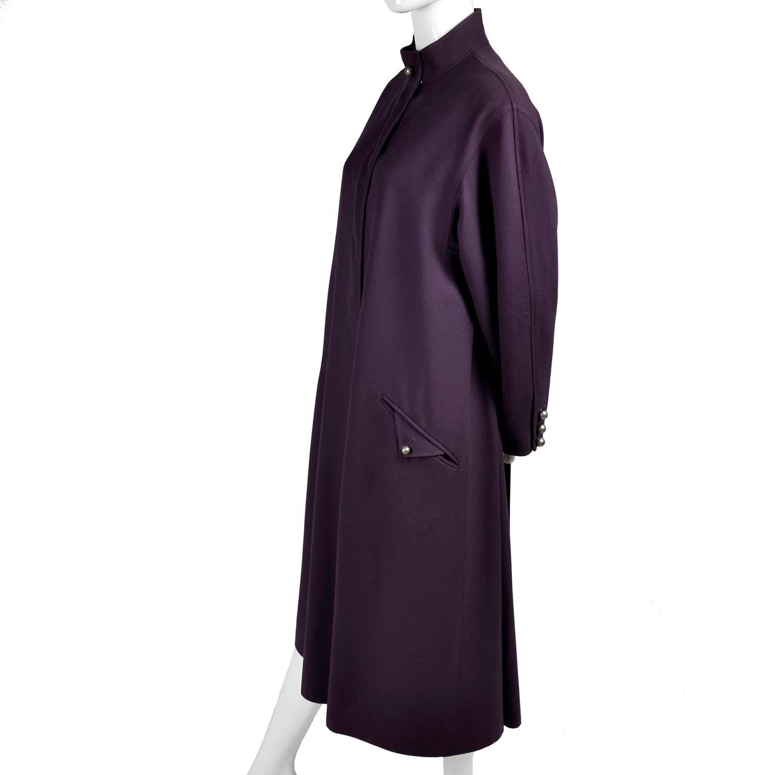 This is a beautiful purple wool vintage coat from Louis Feraud that was made in W. Germany in the 1980's.  The coat has pockets and can be worn open or with the buttons buttoned up to the high neck.  This great coat is lined with Louis Feraud