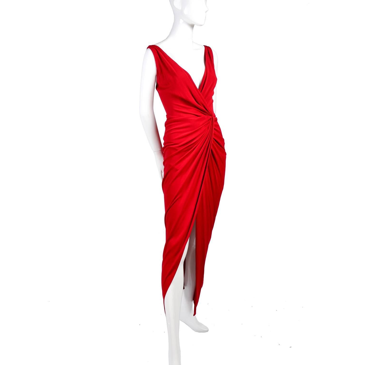 This is an incredible vintage red draped evening gown from Randoph Duke. This vintage dress has incredible draping, a low back, a slit up the leg and it is a show stopping, body hugging, stunning red carpet worthy piece! Though this is labeled a