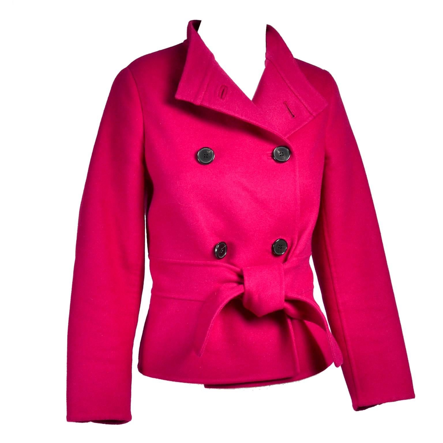 This beautiful Valentino jacket is in a raspberry red wool angora blend and is lined in silk.  The jacket has a fabric belt and is double breasted.  The Valentino L'Amour label reads:  Your eyes are the eyes of a woman in love. Excellent condition