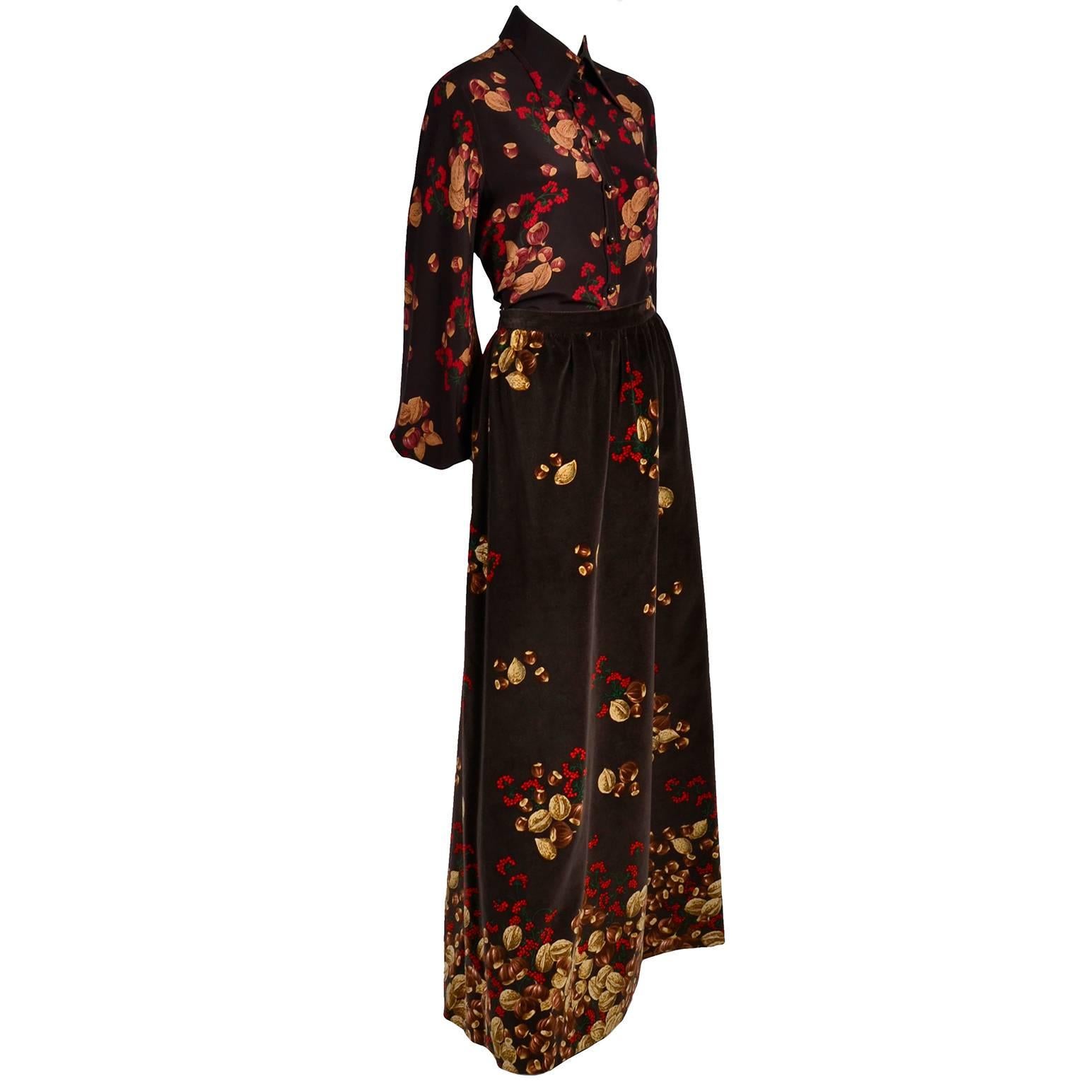 This is a beautiful 1970's Valentino outfit in an iconic acorn and red berry print with a silk blouse and a matching velvet maxi skirt by Valentino Boutique. The fully lined skirt is made of beautiful brown cotton velvet with subtle gathering at the