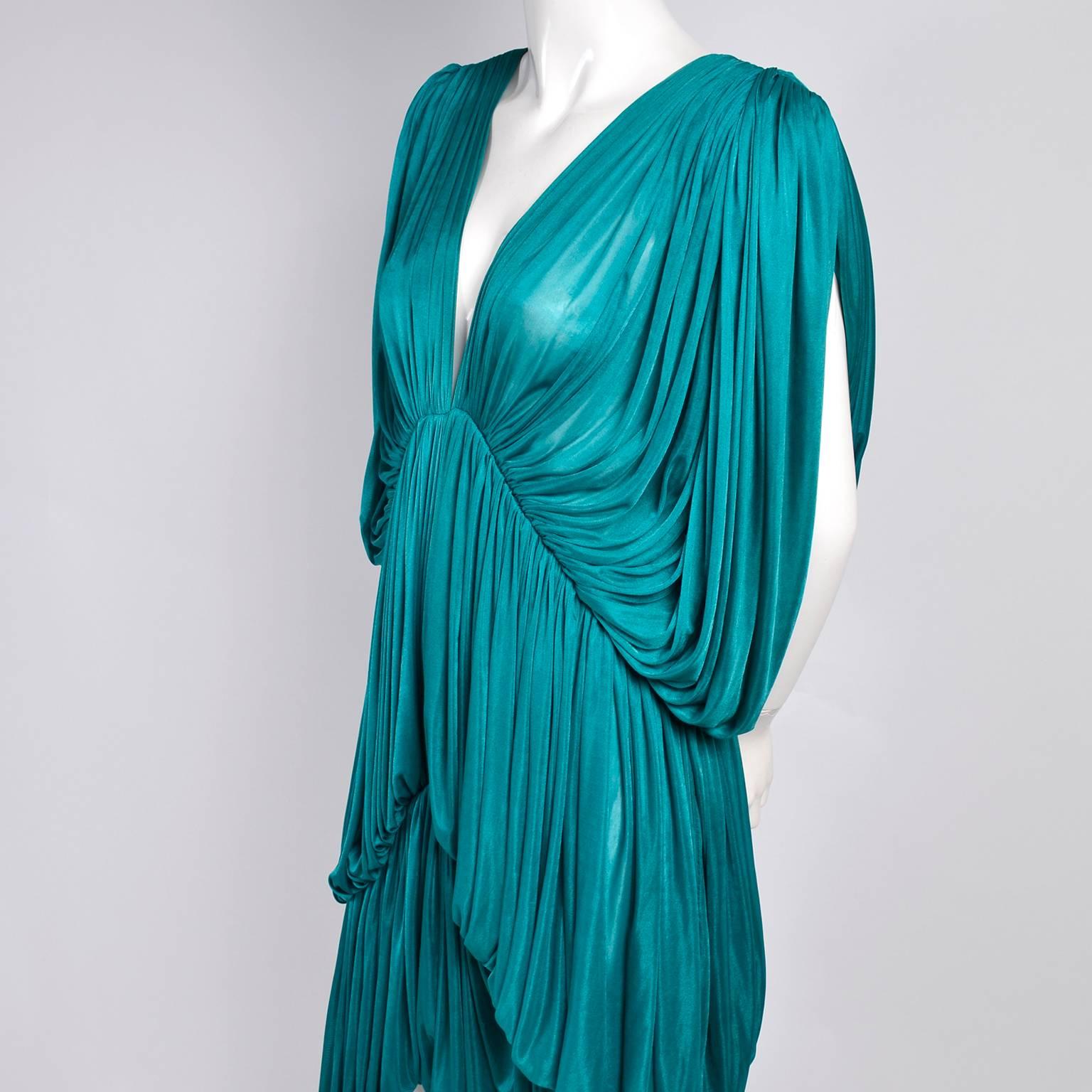 This is an outstanding, rare vintage dress from one of our favorite designers, Norma Kamali. This Norma Kamali OMO butterfly dress is from 1978 and a version of this dress is in the MET museum. This dress has three tiers of gorgeous pleated fine