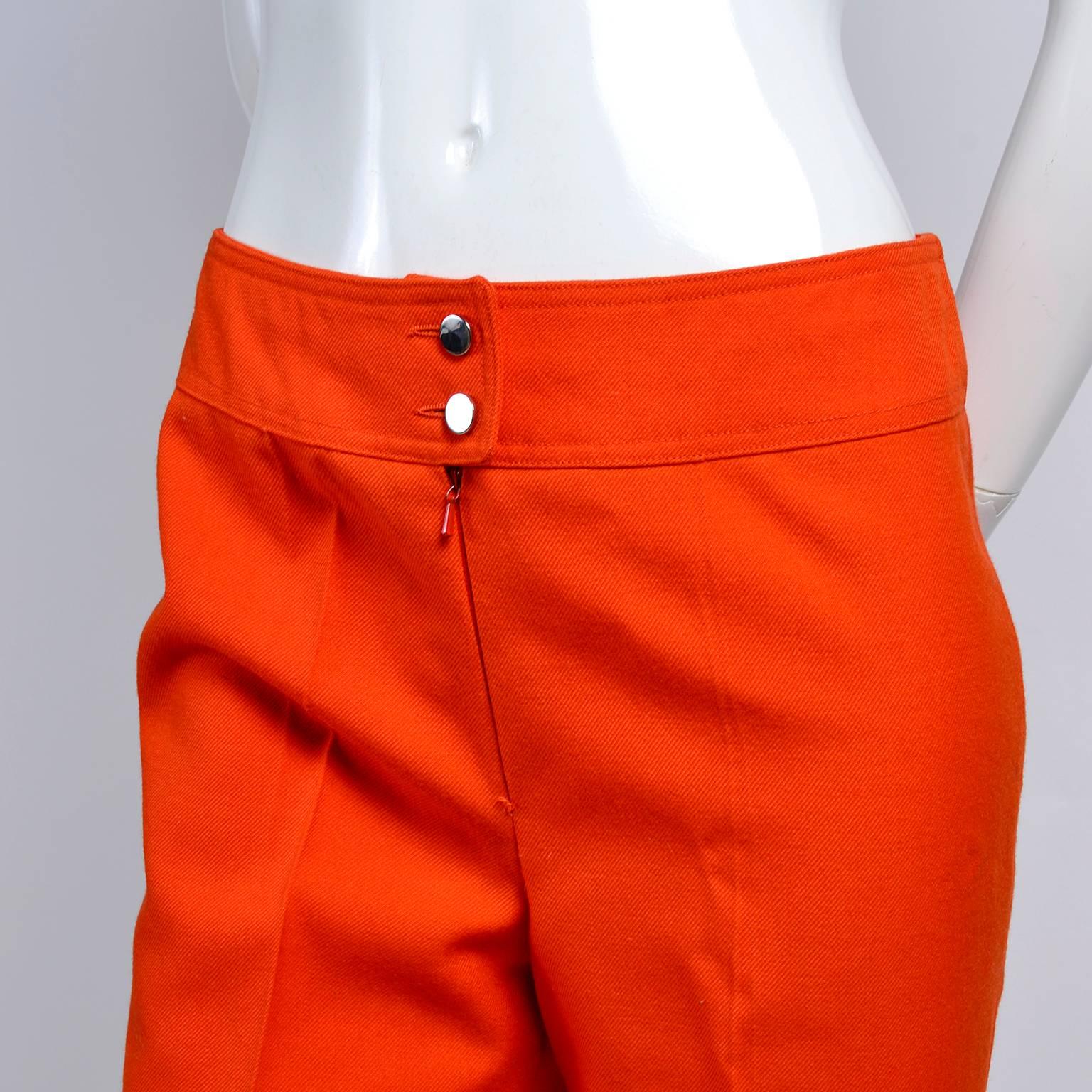 These are fabulous wool pants from Courreges Paris in a gorgeous, rich orange wool fabric.  These wool trousers are fully lined and have a zipper and two silver snap closure in front. There are no pockets, but there is a unique panel in the back. We