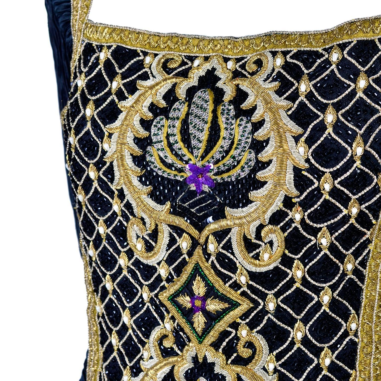 This Mary McFadden Couture Vintage black dress is beautifully pleated in Fortuny style with a heavily embellished bodice. The bodice has gold braid, thick metallic gold embroidery, beading, tIny pearls and sequins. This sensational evening gown has