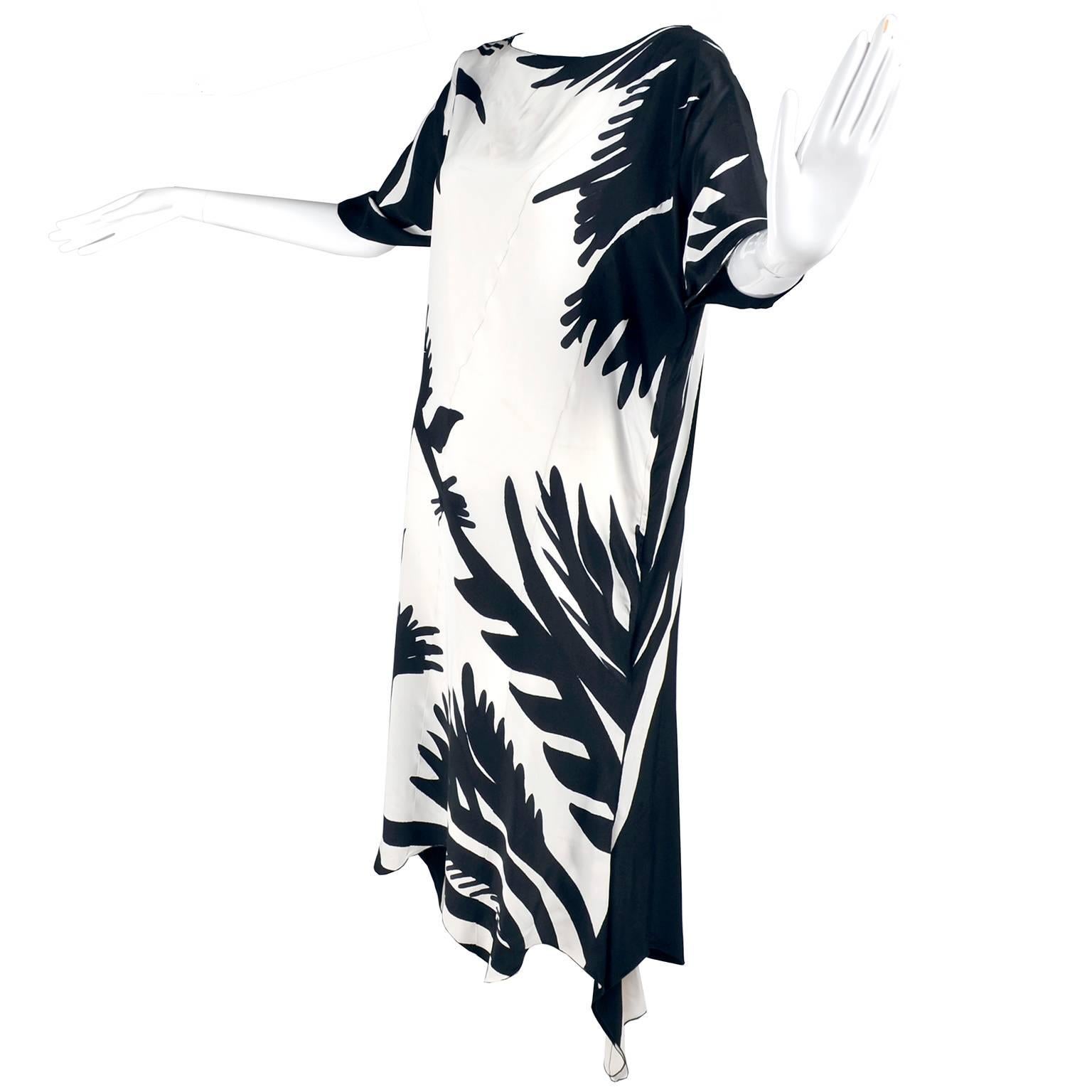We acquired this gorgeous caftan from an estate of very high end designer pieces from the 1970's and 1980's.  This piece no longer has a label but is beautifully made with exceptional details.  The dress is black with white on the back and white
