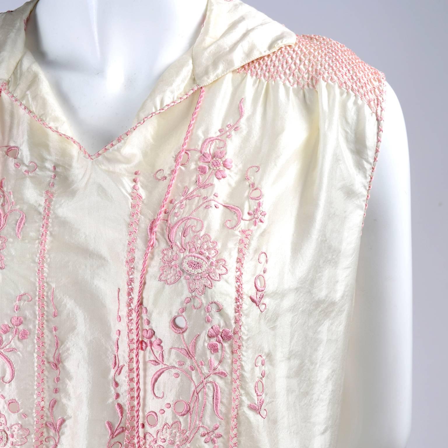 white dress with pink embroidery