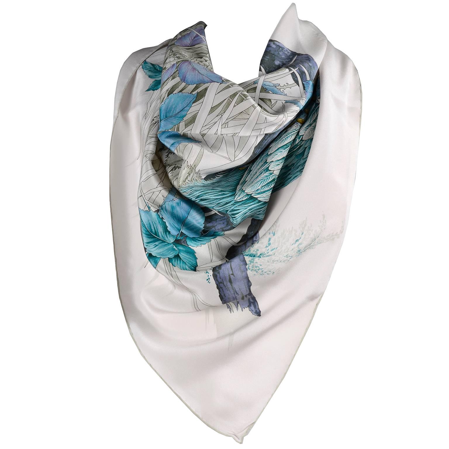 This beautiful Salvatore Ferragamo vintage scarf is in a dove gray silk print with gorgeous pheasants, sea grass and beautiful blue flowers. The scarf measures 34