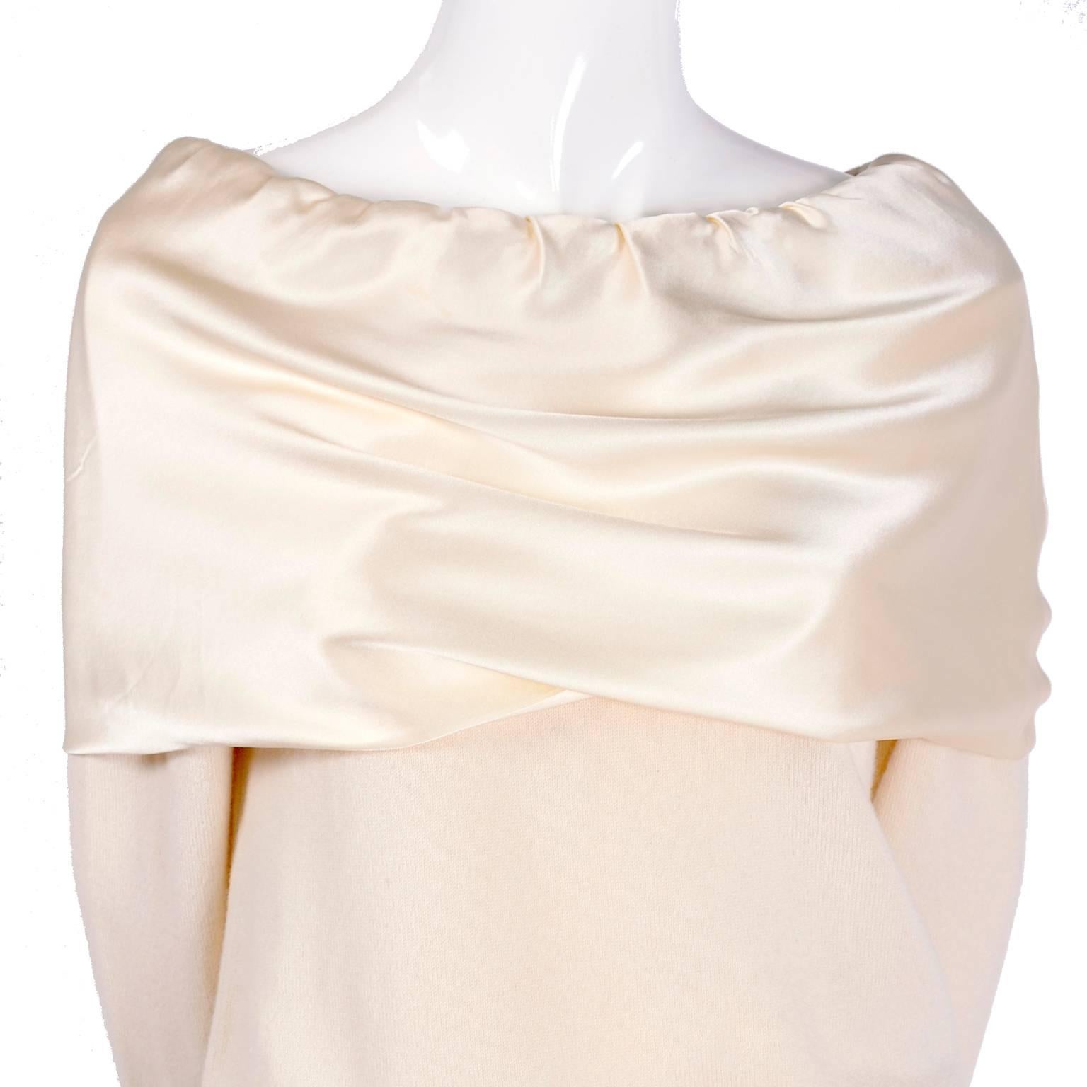 This is a fabulous cream cashmere sweater from Dolce & Gabbana with a silk satin shoulder shawl 