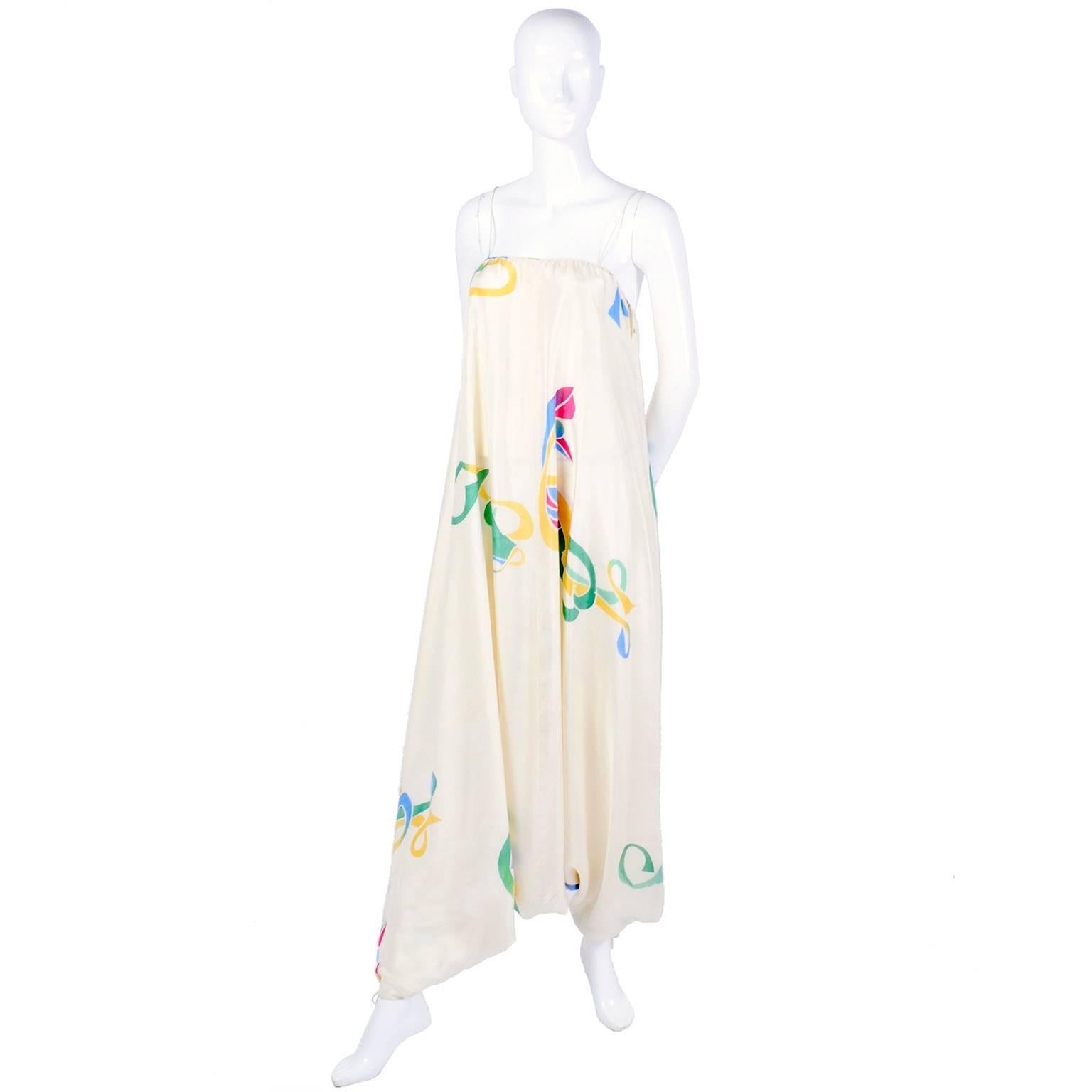 This rare, outstanding hand painted vintage silk jumpsuit was designed by Mary McFadden in the 1970's.  This silk, harem style jumpsuit has spaghetti straps and would be a perfect dress alternative for either day or evening.. The beautiful cream