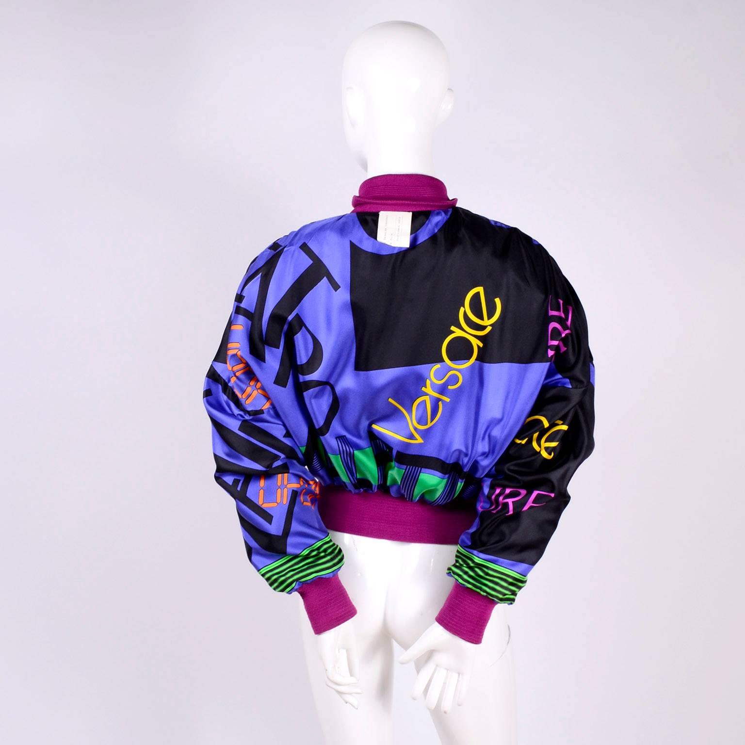 This sensational vintage Versace jacket was designed by Gianni Versace in the 1980's. The jacket is pink suede but the back is a panel of fabric printed with images of very stylish 1980's men. The inside is lined with a patterned silk fabric with