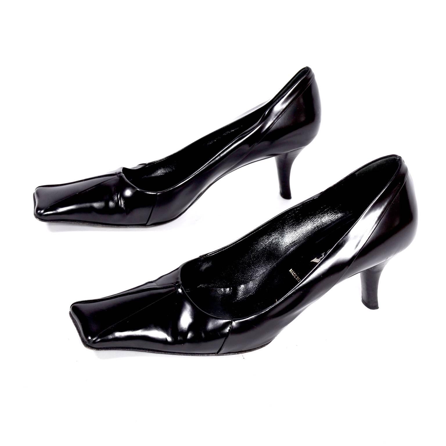 These iconic Prada black leather shoes have the signature square Prada toes, 