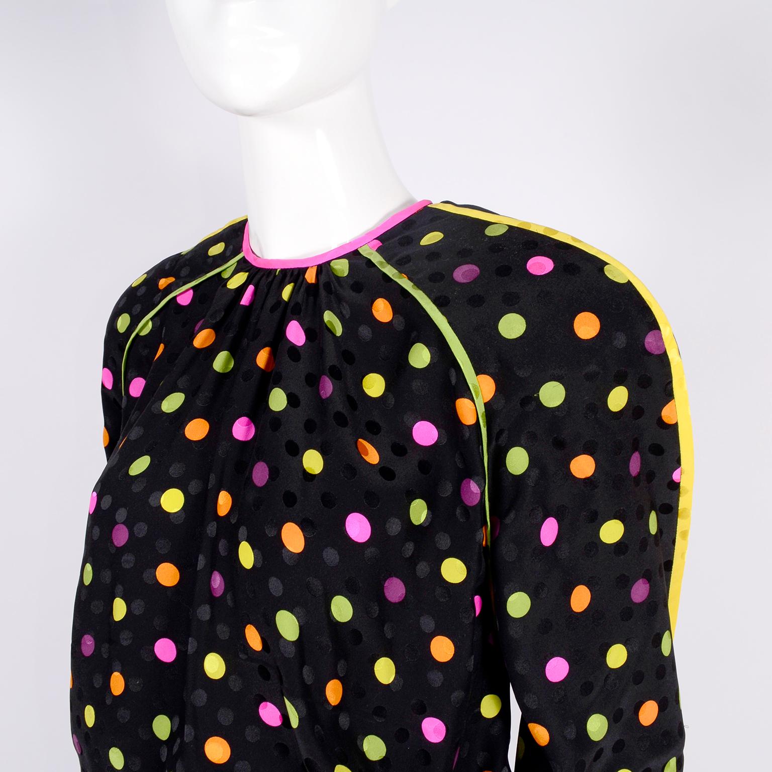 This is a fabulous vintage 1980’s 3 piece dress that looks like it would fit in on today's runways! The fabric is a black silk with tone in tone black dots and a colorful abstract paisley print on the skirt and multi colored dots on the top. The top