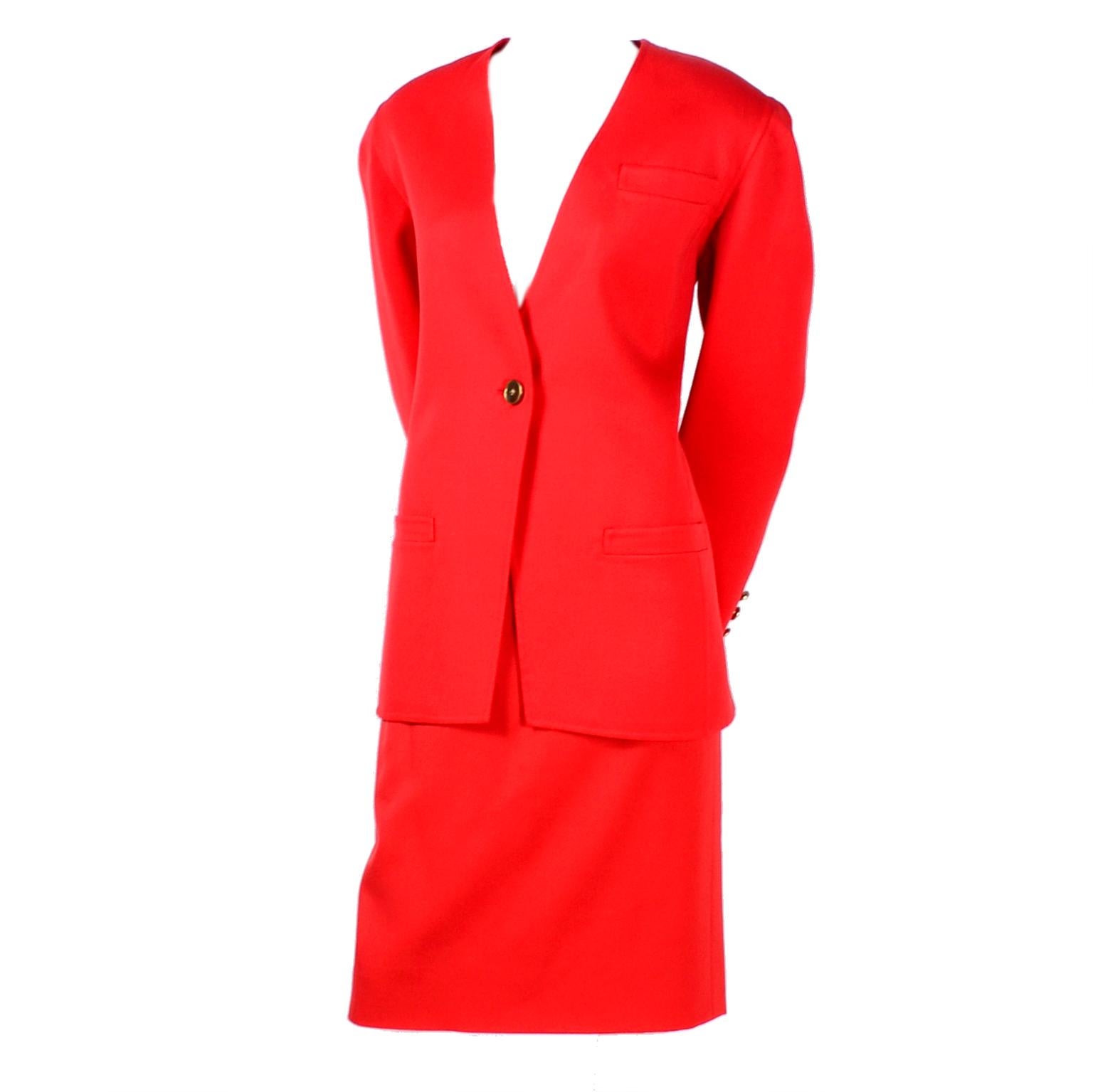 This is a gorgeous Bill Blass 3 piece outfit with a blazer jacket and option of skirt or high waisted pants all in bright red/orange wool. The jacket has one front button for closure, and three buttons on each cuff. It has three pockets, and