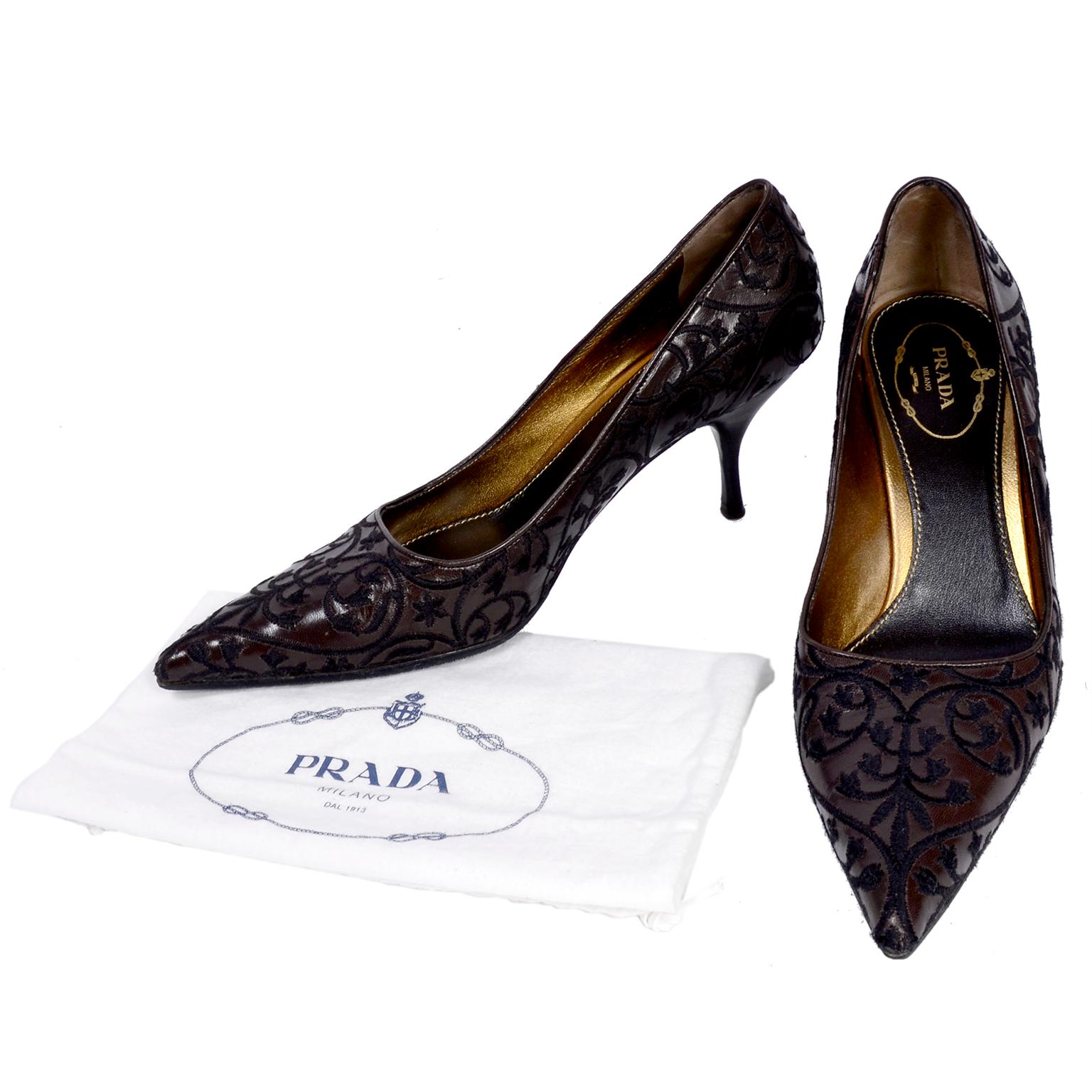 We adore these pointed toe Prada Milano heels in shiny brown leather. The shoes are embroidered with dark brown thread in swirling flowers and vines. These beautiful pumps were made in Italy and are marked a size 37 1/2. These Prada shoes come with