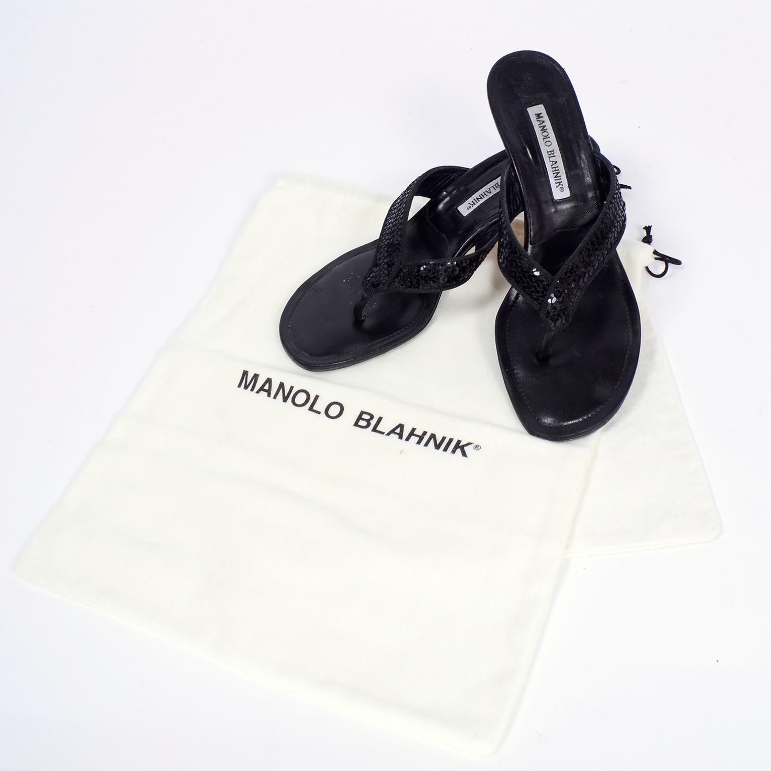 We love Manolo Blahnik, and these black leather low heel thong sandals are another reason to admire the designer!  They could just be ordinary thong sandals, but nothing is ever ordinary with Blahnik, so he embellished them with black sequins across