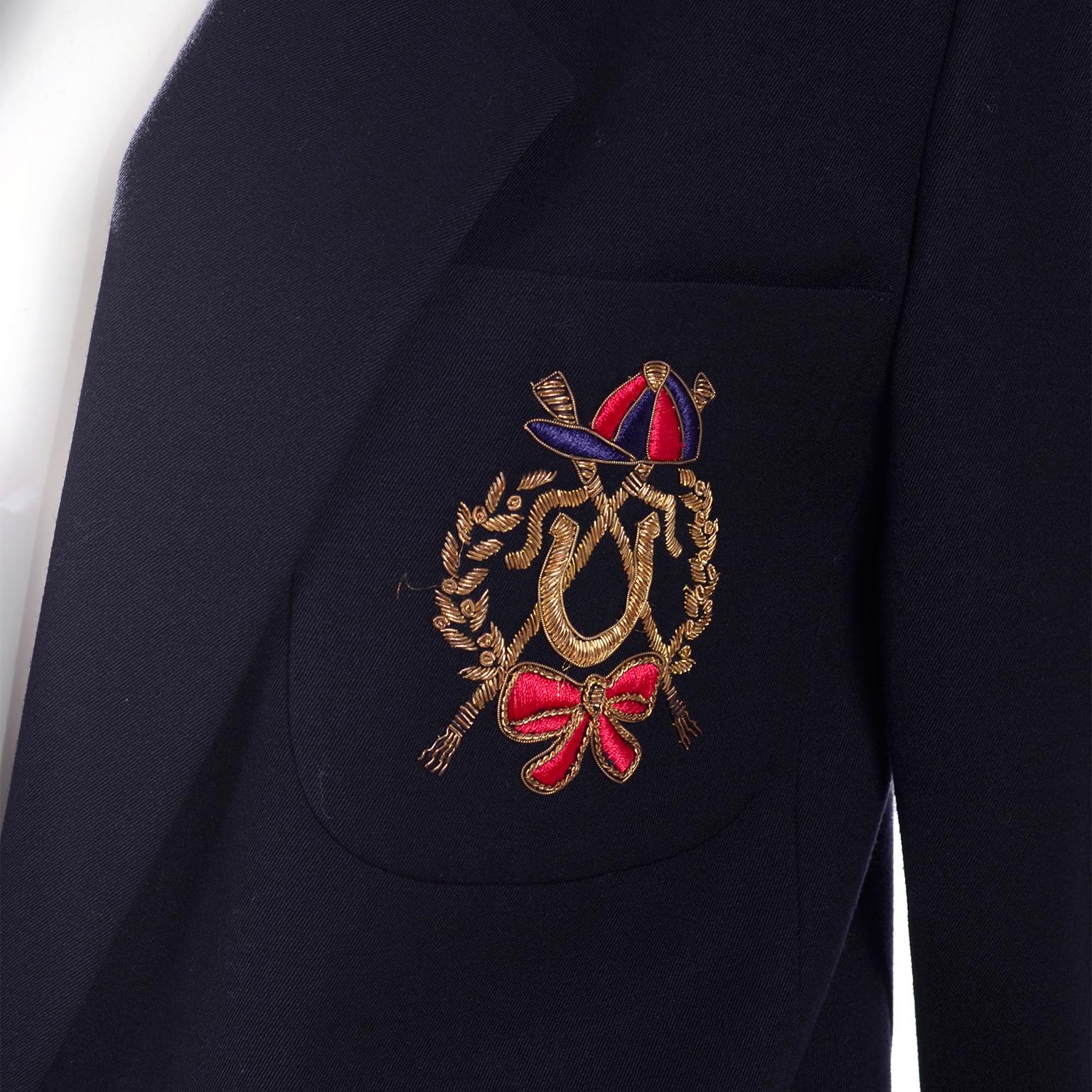 We love Escada! This vintage 1980's Escada blazer was designed by Margaretha Ley and it has so much style! This great Escada jacket closes with a single button and has a wonderful equestrian themed emblem patch sewn in. Labeled a vintage size 38, we