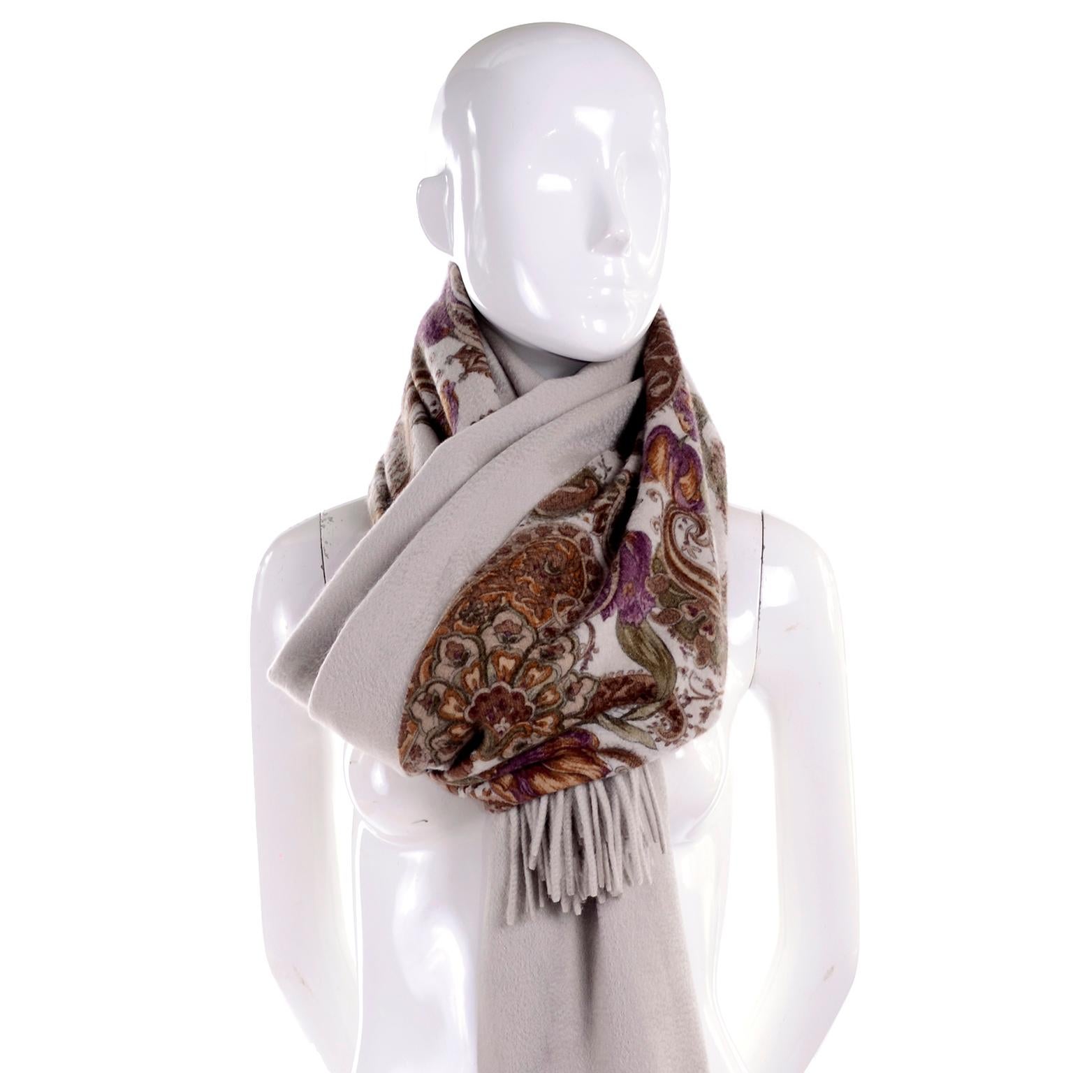 This is a luxurious Loro Piana cashmere scarf or wrap in a beautiful rich print in shades of purple, green, burgundy and beige on a beige background.  The scarf can be worn with the solid side or printed side up.  New with original tags attached,