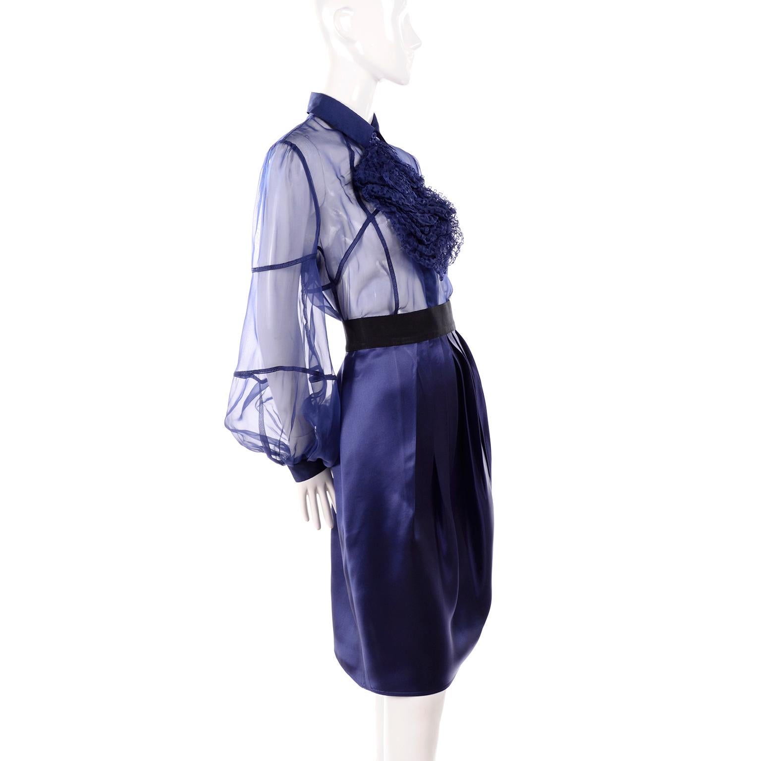 This stunning blouse and skirt ensemble is from the Valentino Fall Winter 2008 Collection. It was shown on the runway with a jacket and we have attached an image of that suit for you to see. We love the ruffled piece on the sheer blue blouse and the