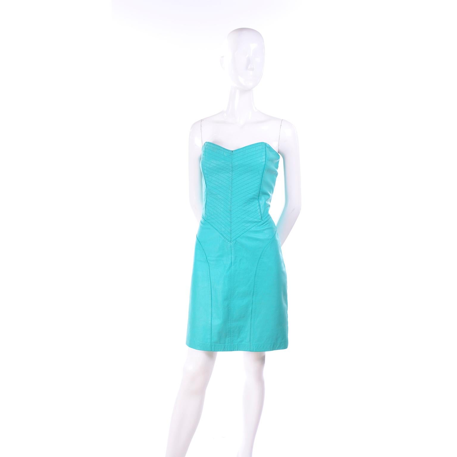 This is a vintage Yucatan Bay 1980's Strapless Turquoise Leather Dress	from the 1980's. This strapless leather dress has interesting top-stitching and detailed seams. The dress can be dressed up for evenings or worn as a day dress!  This great 80's