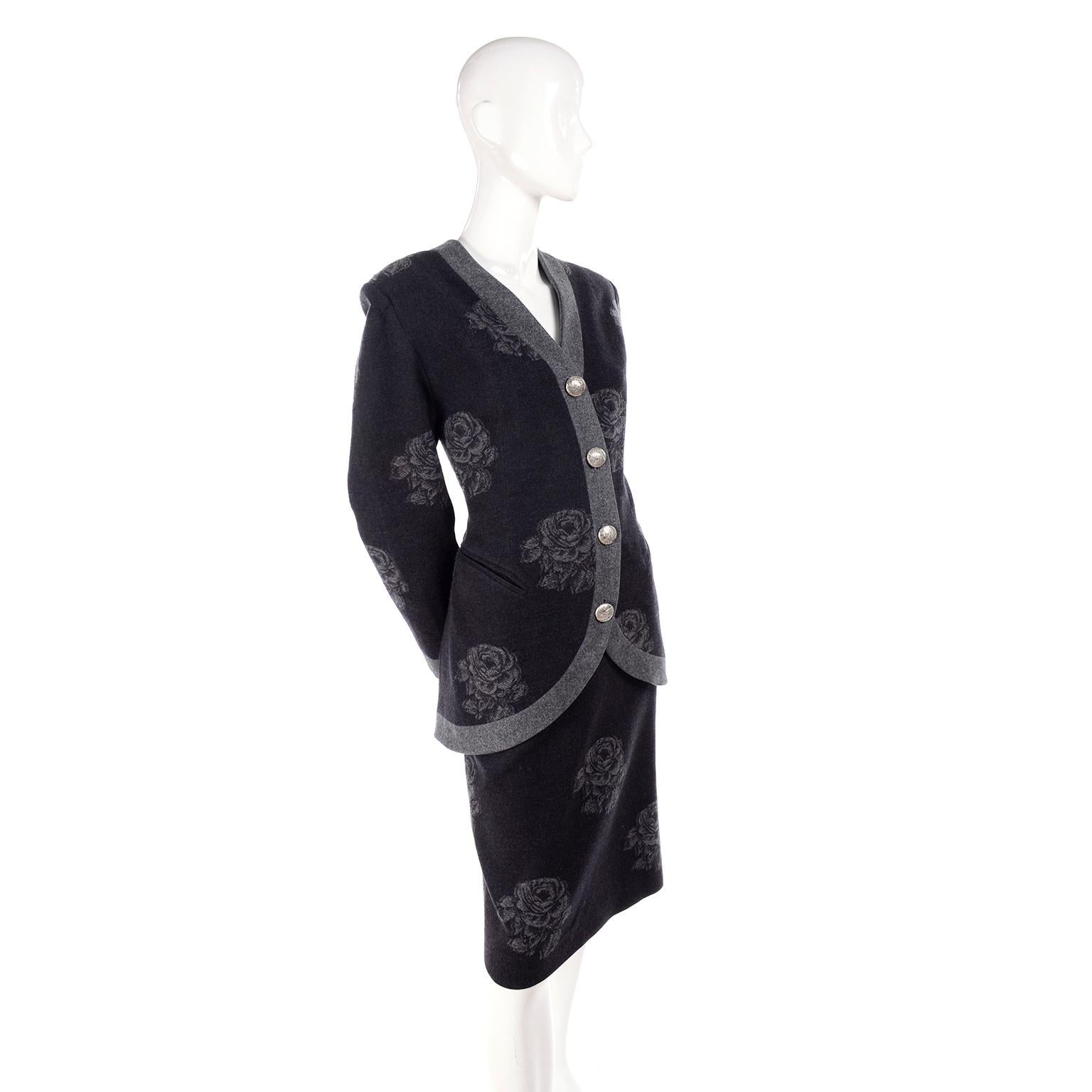 This is a vintage Nina Ricci skirt and jacket suit that is in a gray and black floral printed wool. Made in France, this outfit is so lovely and has so many interesting design elements. The blazer is almost like a structured cardigan and has large