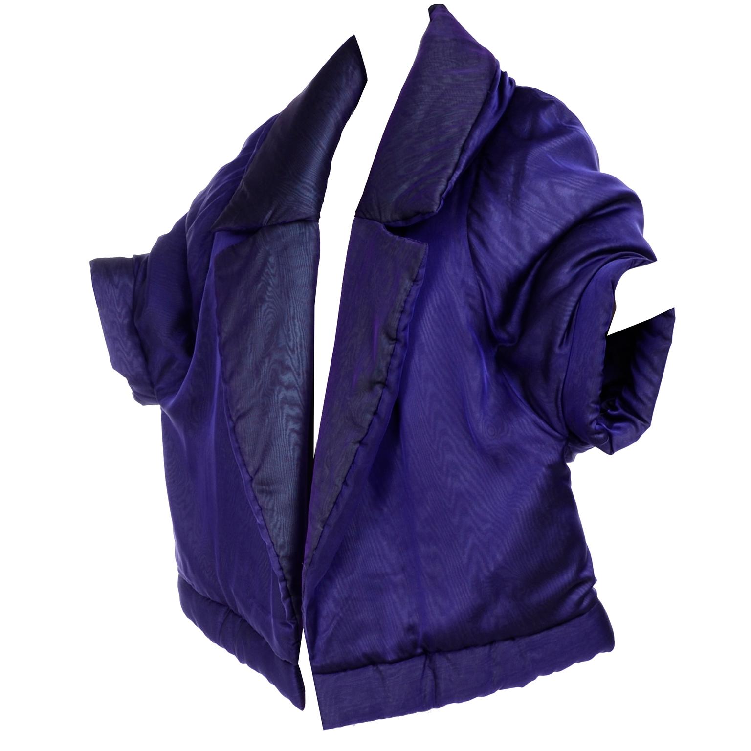 This absolutely sensational Gianfranco Ferre avant garde puffer style coat is in a deep, rich purple silk luxe fabric.  The coat is probably one of our favorite pieces with its exaggerated shawl collar and dramatic abstract kimono style statement