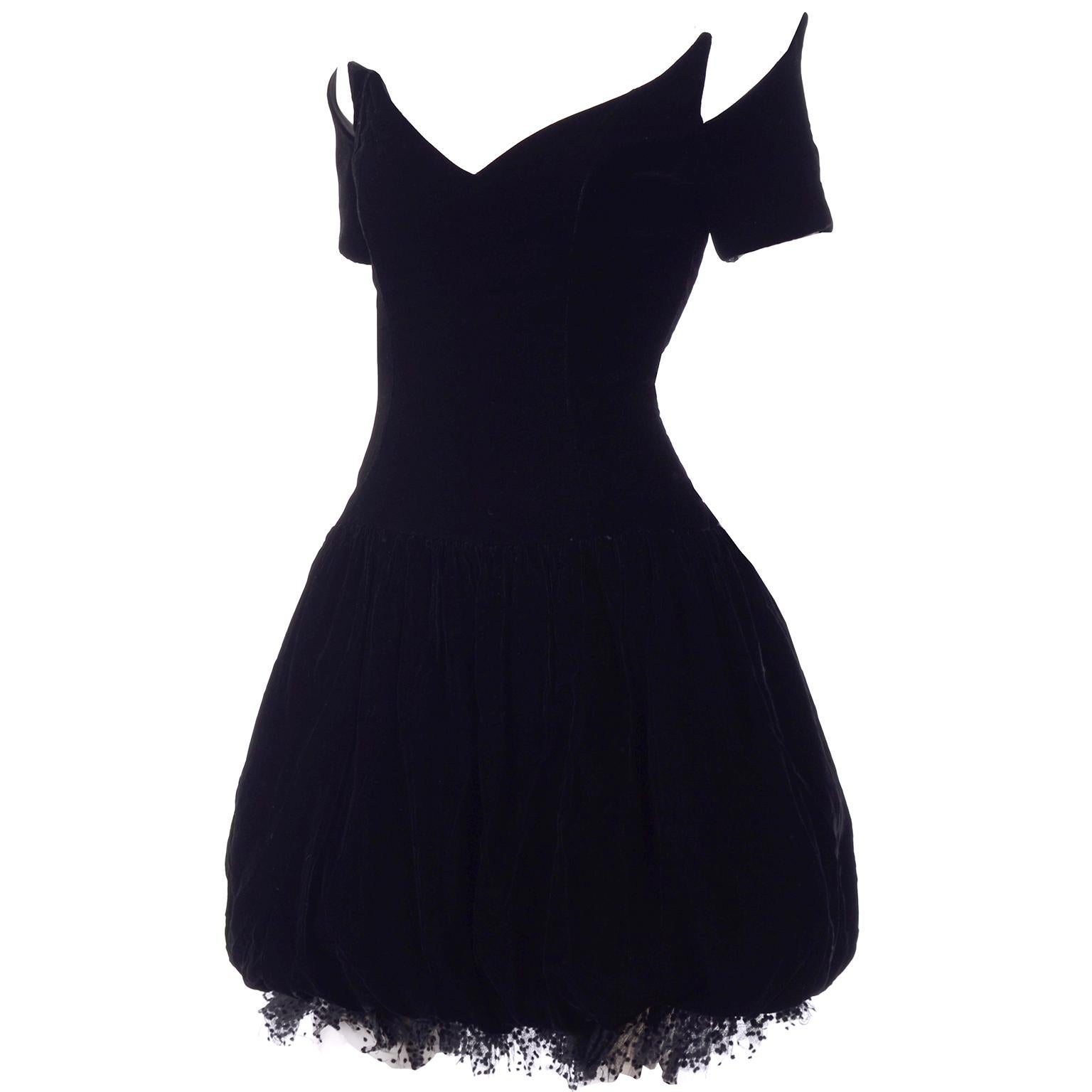 This is an absolutely stunning vintage black velvet Christian Dior party dress! This Dior beauty has a pouf skirt and a 2