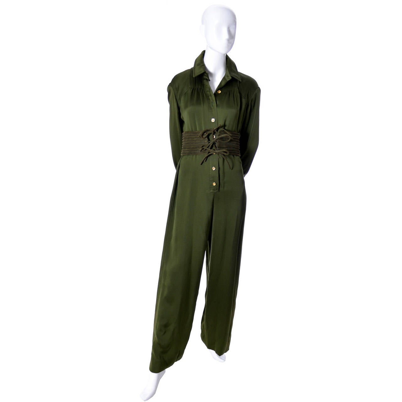 This is such a beautiful green silk jumpsuit from James Galanos with a corset style dark green belt. Perfect for Fall and we think it can be worn in the evening or during the day! We acquired this incredible vintage jumpsuit from a woman who wore