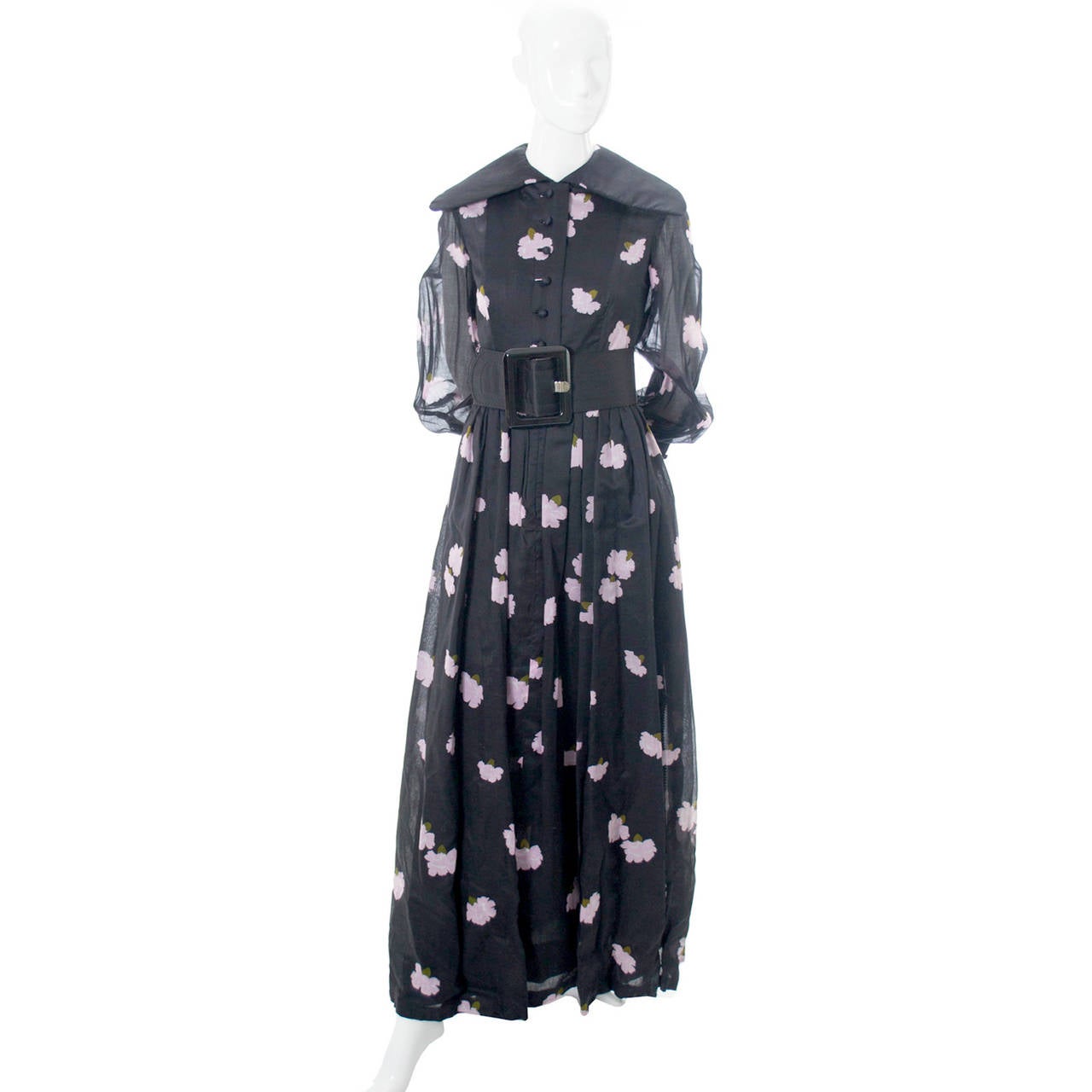 This rare vintage black and pink floral Geoffrey Beene dress is from one of our more prominent estates and it is truly spectacular. This incredible vintage dress comes with its original fabulous satin covered belt that is just under 4