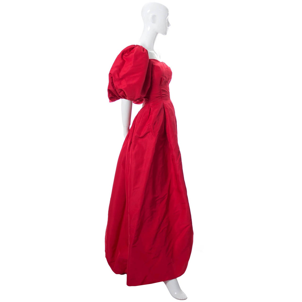 This beautiful red satin ballgown is by designer Rosalie MaCrini and it came from an estate of vintage clothing that included many of the most important American higher end mid century designers.  Rosalie MaCrini was a designer of formal and