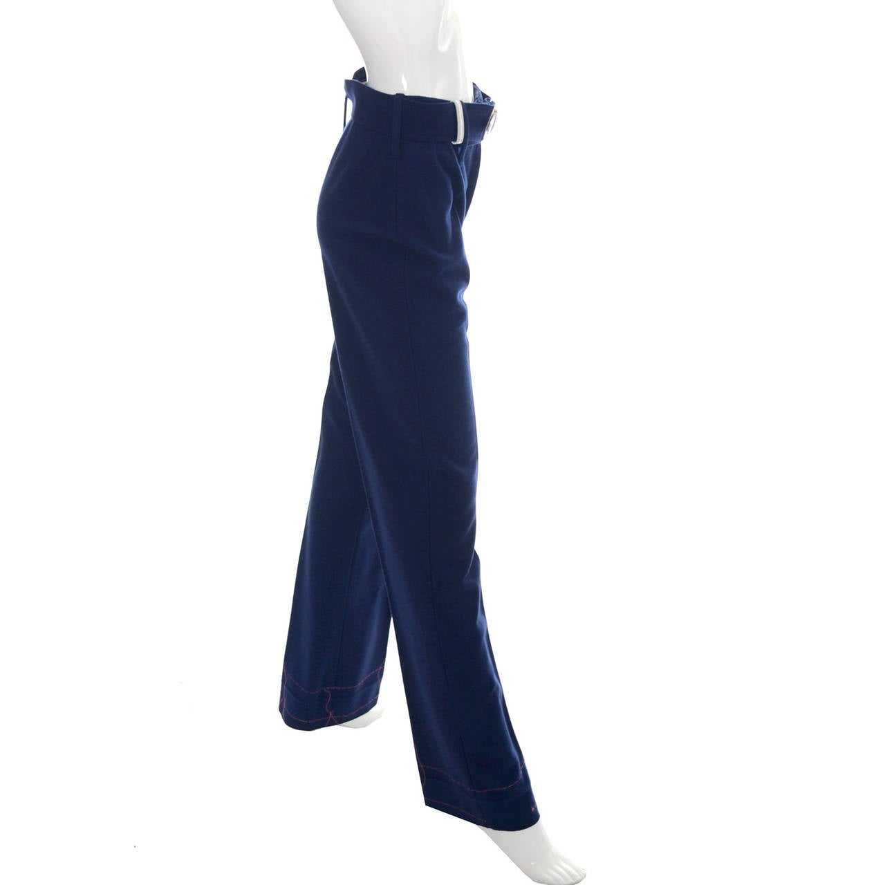 This is a pair of vintage 1970's Hermes Sport blue wool pants with original white belt that were made in France exclusively for Bonwit Teller.  These pants have never been worn and have the original thread with no hem,  showing they were never