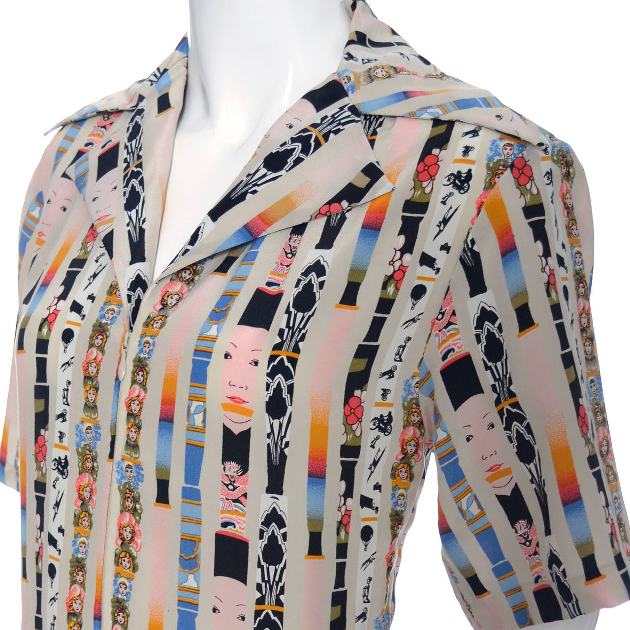 This gorgeous silk vintage dress is from Loewe and was purchased in the late 1970's. The dress has a pleated skirt and drop shirt waist bodice with a zipper.  The novelty print of this pretty vintage silk dress has faces, hot air balloons,
