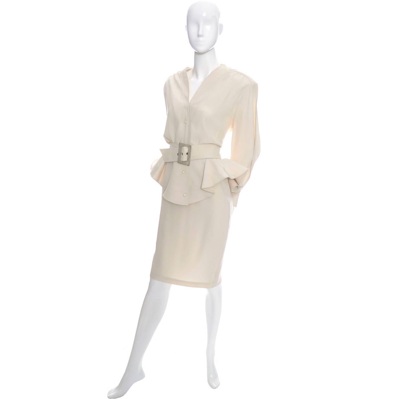 This 1980's vintage 2 piece skirt suit was designed by the French designer,  Thierry Mugler who is known for his structured design aesthetic.  His clothing always has defined shapes and his uses unique design elements like the peplum on the 80's